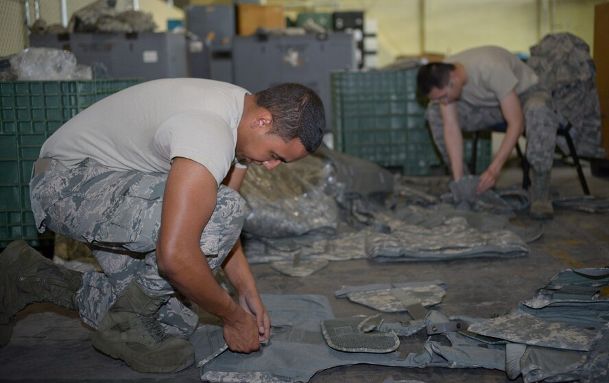 Airman 1st Class Justin Acevedo, 2nd Logistics Readiness Squadron flight service center apprentice, assembles individual protective equipment on Barksdale Air Force Base, La., April 8, 2015. IPE is inspected, reassembled and stored for further use or distributed to other military bases. (U.S. Air Force photo/Senior Airman Benjamin Raughton)