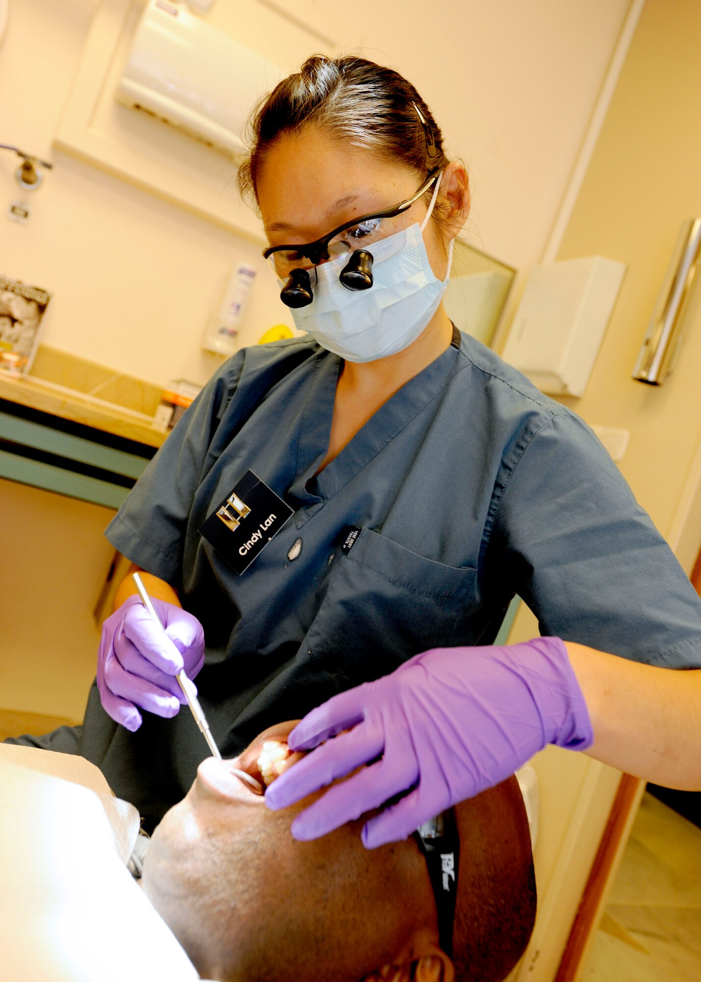 Capt. Cindy Lan, 39th Medical Operations Squadron dentist, performs a routine checkup on a patient April 9, 2015, at Incirlik Air Base, Turkey. The 39th MDOS assists the 39th Medical Group in being the U.S. Air Force’s only medical treatment facility in Turkey. (U.S. Air Force photo by Senior Airman Krystal Ardrey/Released)