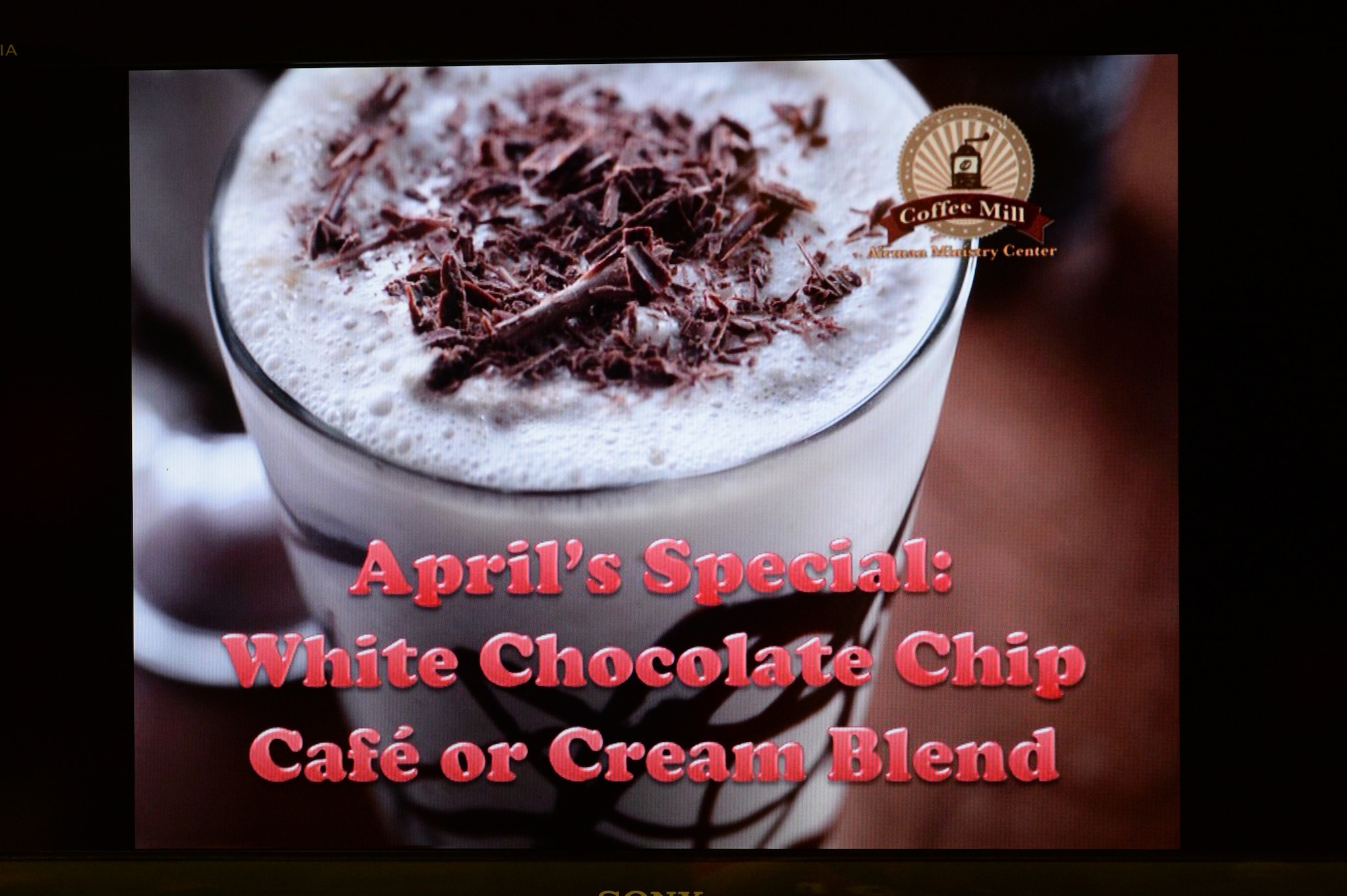 A TV displays April’s drink special at the Coffee Mill on Spangdahlem Air Base, Germany, April 10, 2015. The chapel is always looking for volunteers to keep The Coffee Mill open. If you are interested in volunteering contact U.S. Air Force Chaplain Capt. Kelly Stahl, a 52nd FW chaplain, at 452-6711. (U.S. Air Force photo by Senior Airman Dylan Nuckolls/Released)