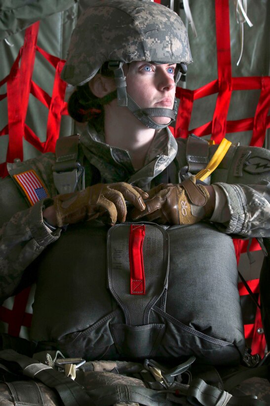 Army 1st Lt. Lauren Hogg waits to hook up her static line to the anchor line cable inside a U.S. Marine Corps C-130 Hercules aircraft over Malemute drop zone on Joint Base Elmendorf-Richardson, Alaska, April 13, 2015.