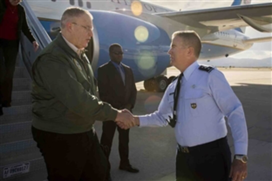 Deputy Defense Secretary Bob Work, left, exchanges greetings with Air Force Lt. Gen. Michael Dubie, deputy commander of U.S. Northern Command and vice commander of the U.S. element of the North American Aerospace Defense Command, upon arriving on Peterson Air Force Base, Colo., to meet with service members, April, 14, 2015.