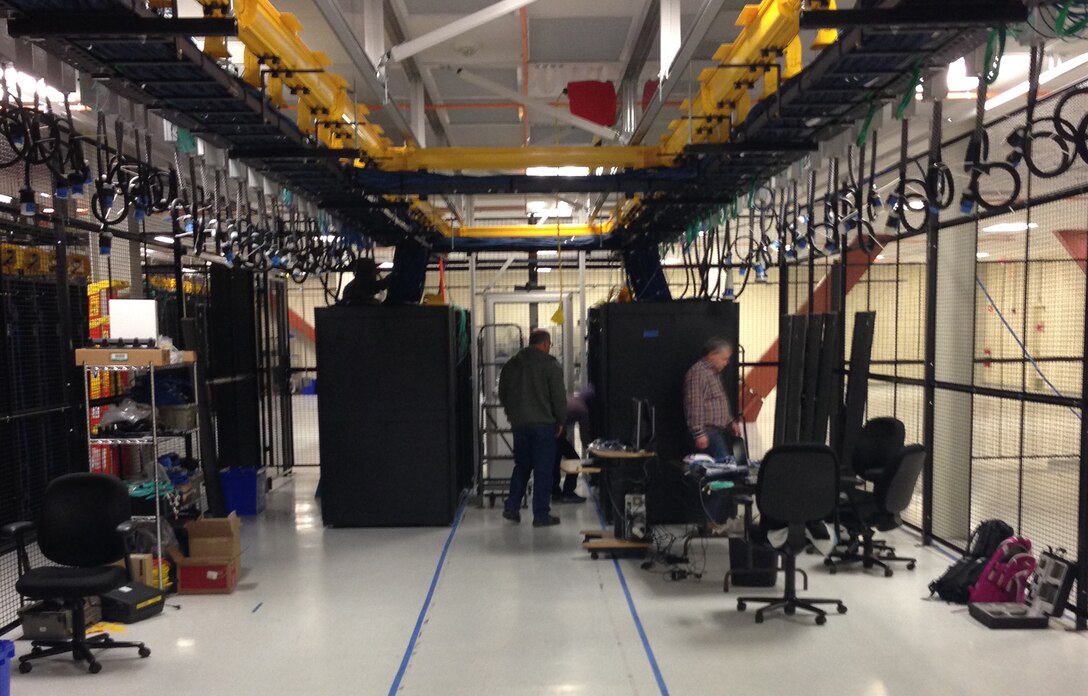 Technicians install information technology equipment at the new U.S. Army Corps of Engineers Western Processing Center in Hillsboro, Oregon. Due to weight limitations at the Western Processing Center’s original location, all equipment had to be moved out by March 19 and in its new location and operational by March 22. Huntsville Center’s Information Technology Services ACE-IT branch supported the requirement awarding a single $1.3 million Firm Fixed Price contract to a Portland, Oregon area IT firm on Dec. 24. The work was completed within the allotted timeline and met all operational requirements.