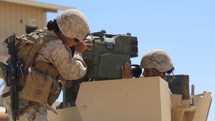 Sergeants Emma A. Bringas, left, and Maya Marin C. Garnica, both anti-tank missilemen with Anti-Armor Section, Weapons Company, Ground Combat Element Integrated Task Force, secure an M41A4 Saber missile launcher atop a Humvee during a Marine Corps Operational Test and Evaluation Activity assessment at Range 107, Marine Corps Air Ground Combat Center Twentynine Palms, California, April 12, 2015. From October 2014 to July 2015, the GCEITF will conduct individual and collective level skills training in designated ground combat arms occupational specialties in order to facilitate the standards-based assessment of the physical performance of Marines in a simulated operating environment performing specific ground combat arms tasks. 