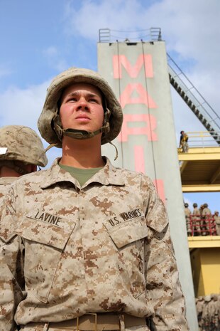 Recruit Adam J. LaVine, Platoon 3263, Mike Company, 3rd Recruit Training Battalion, awaits his turn to rappel down an a 60-foot tower at Marine Corps Recruit Depot San Diego, April 10. LaVine is a St. Louis native and was recruited out of Recruiting Station St. Louis. Today, all male recruits recruited from recruiting stations west of the Mississippi are trained at MCRD San Diego. The depot is responsible for training more than 16,000 recruits annually. Company M is scheduled to graduate from recruit training on April 24.