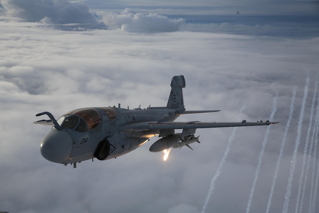 Naval aviators with Marine Tactical Electronic Warfare Training Squadron 1 shoot flares from an EA-6B Prowler during routine training above Eastern North Carolina, April 14, 2015.  VMAQT-1 student pilots and electronics countermeasures officers train to perform dynamic maneuvers while focusing on communication and radar jamming.