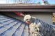 Air Force Reserve Master Sgt. David Hodge points out the smoke and water damage on his roof after a house fire April 14, 2015, in Colorado Springs, Colo. Hodge is assigned to the 6th Space Operations Squadron.
(U.S. Air Force photo/Tech. Sgt. Nicholas B. Ontiveros)