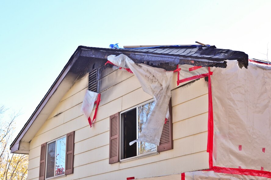 Fire damage on Air Force Reserve Master Sgt. David Hodge's house April 14, 2015, in Colorado Springs, Colo. Hodge is assigned to the 6th Space Operations Squadron.
(U.S. Air Force photo/Tech. Sgt. Nicholas B. Ontiveros)