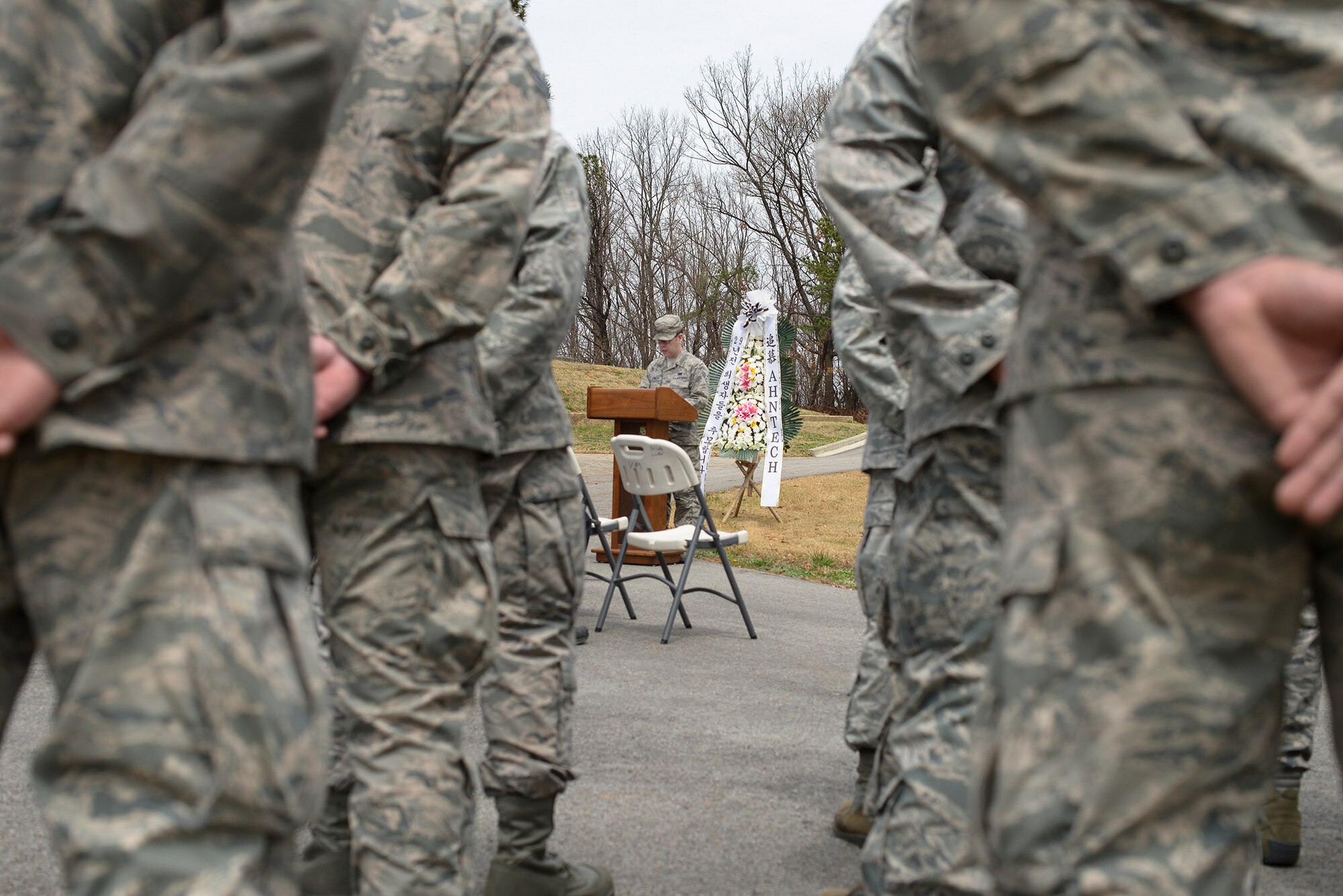 Members of the 51st Logistics Readiness Squadron stand in formation during a memorial ceremony April 4, 2015, at Osan Air Base, Republic of Korea. The ceremony honored the memory of 16  citizens who died in a jet-fuel fire on April 5, 1986. (U.S. Air Force photo by Staff Sgt. Jake Barreiro/Released)