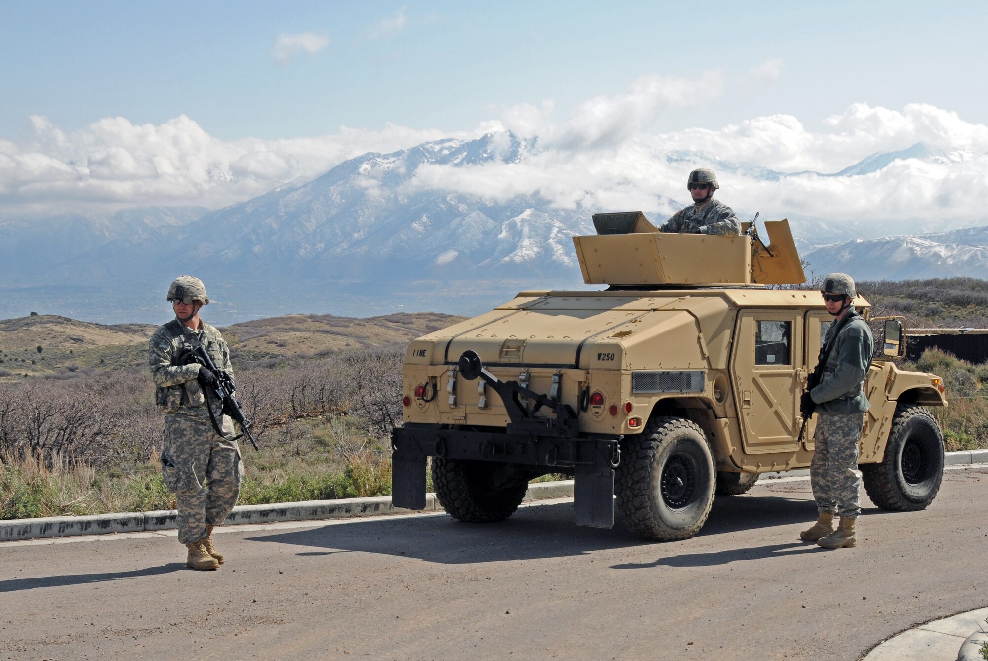 Members of the Army National Guard's 1457th Engineer Battalion participate in a training exercise conducted with explosive ordnance technicians from the Air National Guard's 151st Civil Engineering Squadron at the Improvised Explosive Device Training Lane at Camp Williams, Utah on April 9, 2015. The training scenario involved the removal of a simulated landmine, followed by a discussion with Moroccan State Partners. (Air National Guard photo by Staff Sgt. Annie Edwards/RELEASED)