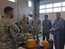 Master Sgt. Timothy Edwards gives a presentation about Utah Air Guard explosive ordnance disposal capabilities to members of the Moroccan military visiting the Roland R. Wright Air National Guard Base on April 7, 2015. The Moroccan delegates visited the state to work with Utah Guardsmen as part of the State Partnership Program. (Air National Guard photo by Capt. Jill Jimenez/RELEASED)