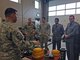 Master Sgt. Timothy Edwards gives a presentation about Utah Air Guard explosive ordnance disposal capabilities to members of the Moroccan military visiting the Roland R. Wright Air National Guard Base on April 7, 2015. The Moroccan delegates visited the state to work with Utah Guardsmen as part of the State Partnership Program. (Air National Guard photo by Capt. Jill Jimenez/RELEASED)