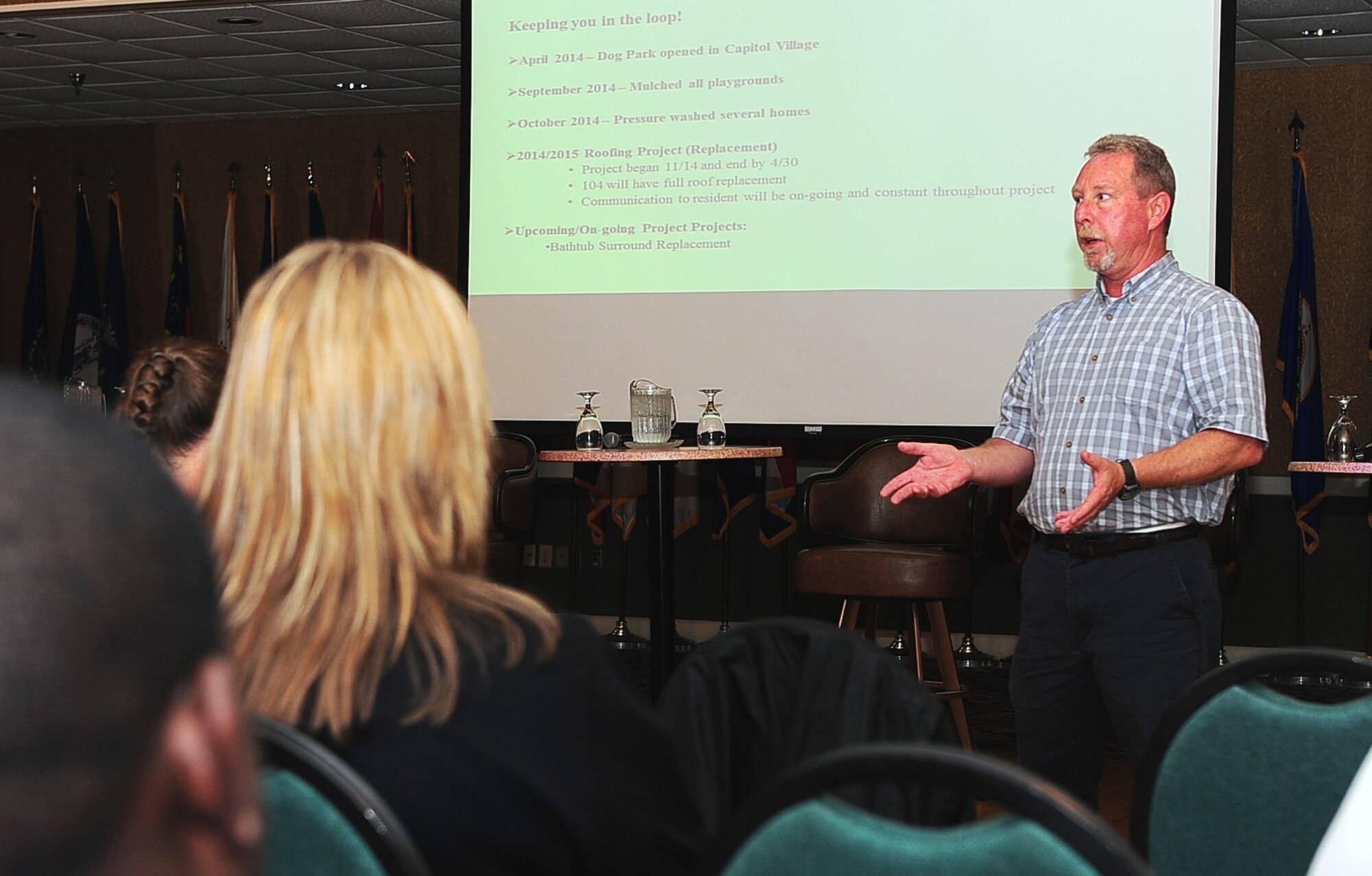 Skip Thompson, Director of Operations for Tidewater Landscaping, briefs Columbus Air Force Base Housing residents during a Town Hall Meeting April 14 at the Columbus Club on Columbus Air Force Base, Mississippi. The meeting featured various briefers who spoke on the various projects in progress, safety concerns and methods to report issues with their estate; afterward, residents voiced their opinions on the state of their houses and asked questions pertaining to their homes. (U.S. Air Force photo/Airman 1st Class John Day)