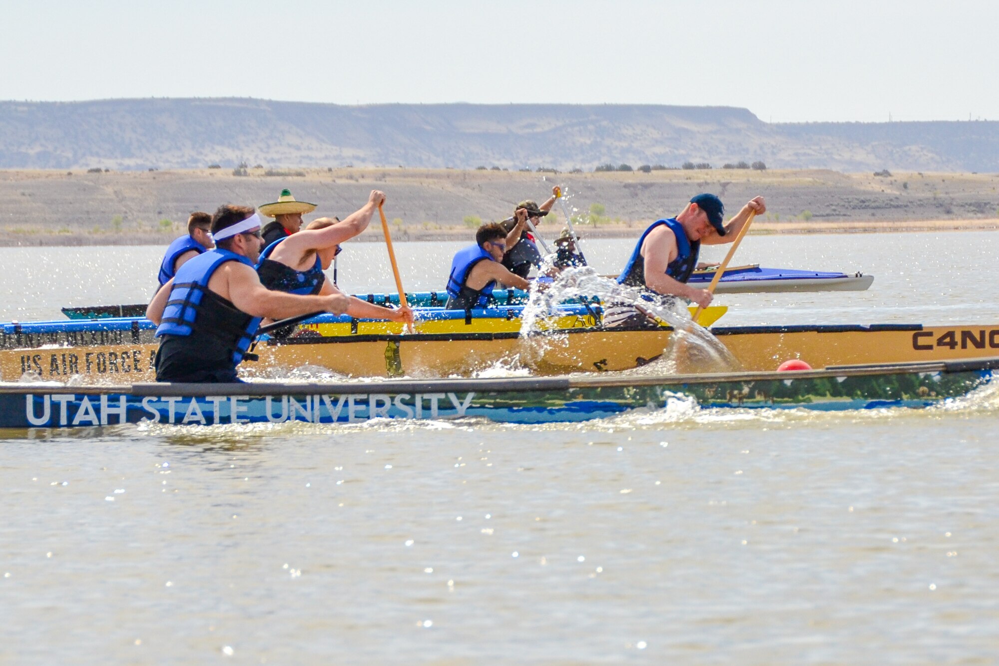 Cadet 1st Class Ben Pagano and Cadet 2nd Class John Eno dig into the water at the start of the men's race. Fifteen cadets from the U.S. Air Force Academy's Civil and Environmental Engineering Department competed in the 2015 American Society of Civil Engineers Rocky Mountain Student Conference concrete canoe competition in Albuquerque, N.M., April 10. The cadets built the canoe during a semester-long project. (Air Force photo)
