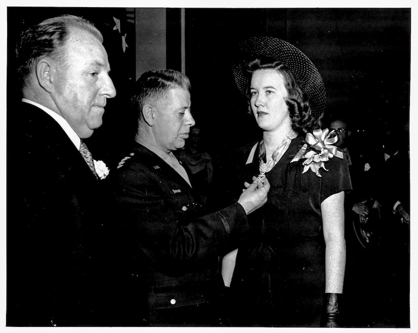 Gen. George C. Kenney presents the Medal of Honor to Marilynn G. McGuire, widow of Maj. Thomas B. McGuire. Maj. McGuire named his P-38 Lightning Pudgy after Marilynn’s high school nickname. (Photo courtesy of 87th Air Base Wing History Office/Released)