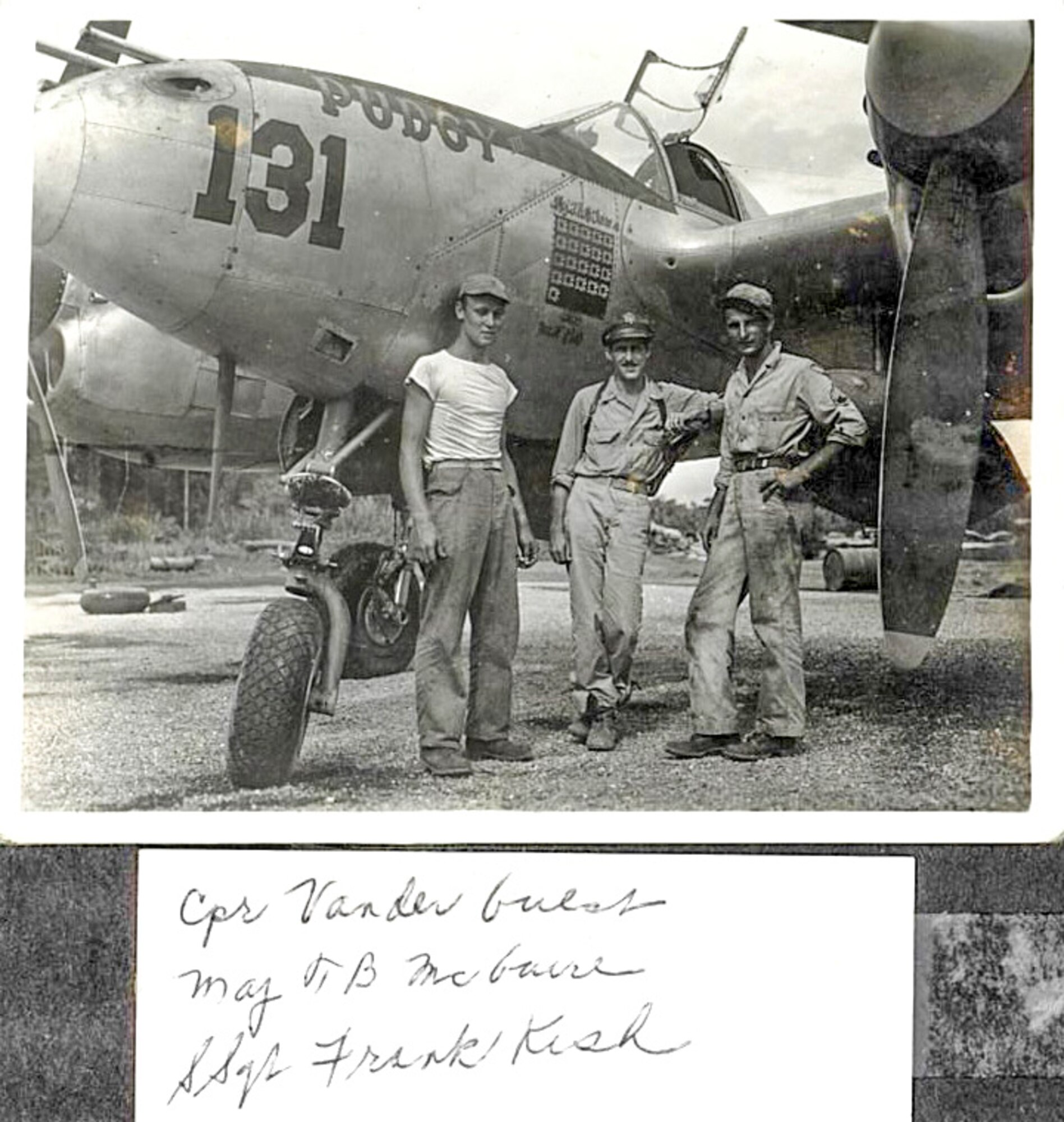 Maj. Thomas B. McGuire (middle) and Staff Sgt. Frank Kish (right) pose with Pudgy, the P-38 Lightning flown by McGuire. (Photo courtesy of 87th Air Base Wing History Office/Released)
