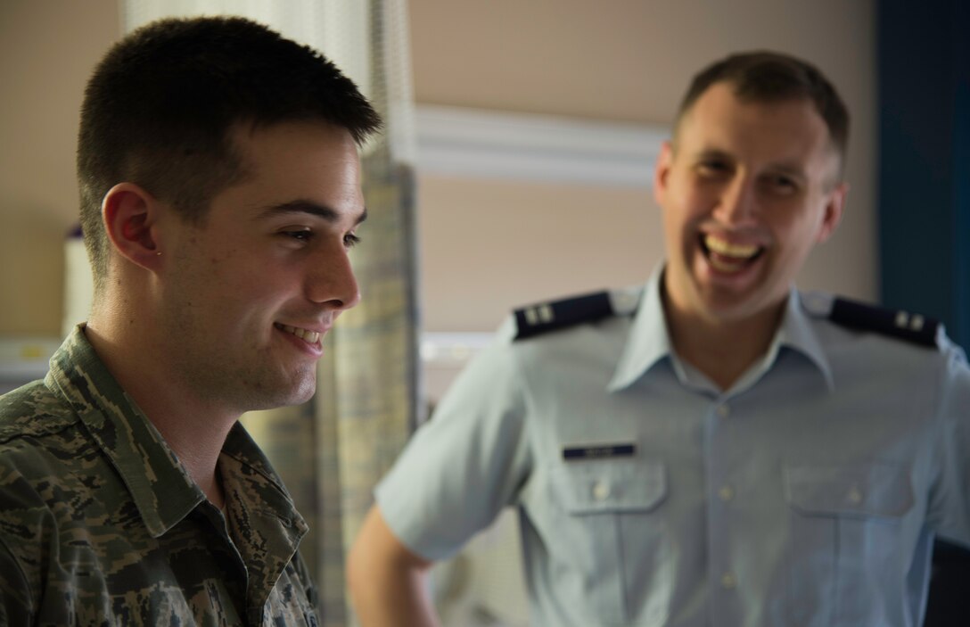 Airman 1st Class Tyler Denis, 779th Medical Operations Squadron member, smiles after receiving three acupuncture needles in his ear at the Malcom Grow Medical Clinics and Surgery Center, Joint Base Andrews, Md., April 15, 2015. The Air Force has a new initiative to complement western medicine with acupuncture care for service men and women in accordance with the May 2010 Pain Management Task Force objective. (U.S. Air Force photo/Airman 1st Class Philip Bryant)