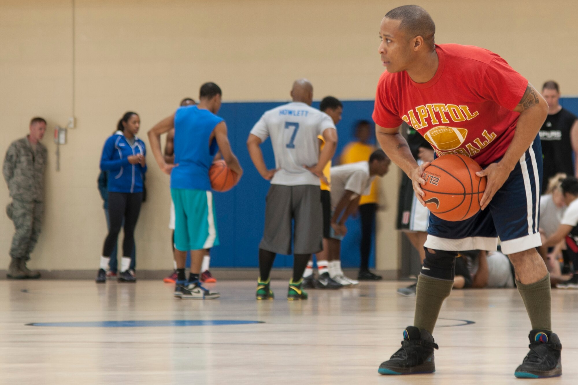 A player waits to pass a ball at the Senior Airman Bryan Bell Fitness Center on Barksdale Air Force Base, La. on April 11th. The 307th Bomb Wing held a four on four basketball tournament as one of the events for its annual family day. (U.S. Air Force photo by 2nd Lt. Monique Roux/Released)