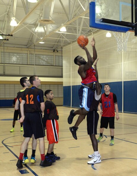 Leon Carswell, 2nd Maintenance Squadron power forward, elevates for a shot in the 2015 intramural championship game on Barksdale Air Force Base, La., April 9, 2015. The 2nd Maintenance Squadron upset the previously-undefeated 2nd Aircraft Maintenance Squadron 62-46 to win the championship and finish the season with an 8-2 record. (U.S. Air Force photo/Airman 1st Class Curt Beach)