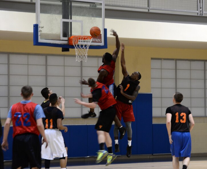 Basketball players battle for a rebound in the 2015 intramural championship game on Barksdale Air Force Base, La., April 9, 2015. The 2nd Maintenance Squadron defeated the 2nd Aircraft Maintenance Squadron 62-46 to win the championship and finish the season with an 8-2 record. (U.S. Air Force photo/Airman 1st Class Curt Beach)