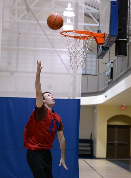 A 2nd Maintenance Squadron Airman warms up with some layups before a game on Barksdale Air Force Base, La., April 9, 2015. The 2nd Maintenance Squadron upset the previously-undefeated 2nd Aircraft Maintenance Squadron 62-46 to win the championship and finish the season with an 8-2 record. (U.S. Air Force photo/Airman 1st Class Curt Beach)