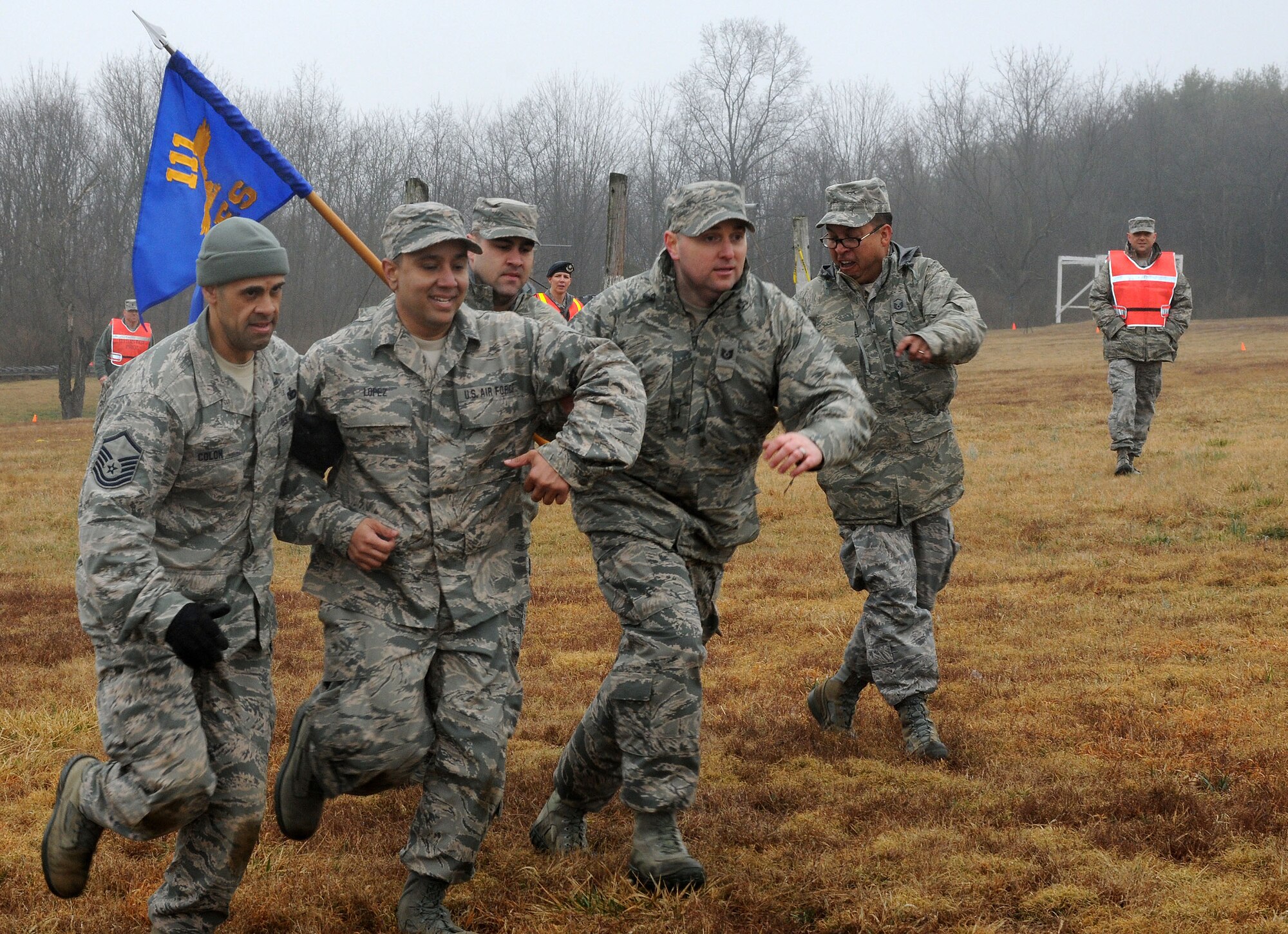 Members of the 111th Security Forces Squadron from Horsham Air Guard Station, Pennsylvania, cross the finish line of the obstacle course during a four-day super drill held April 9 – 12, 2015, at Fort Indiantown Gap and Gettysburg National Military Park. Nearly 60 Guardsmen from the 111th Attack Wing’s security forces squadron participated in the four-day team building and skills-training event. (U.S. Air National Guard photo by Tech. Sgt. Andria Allmond/Released)
