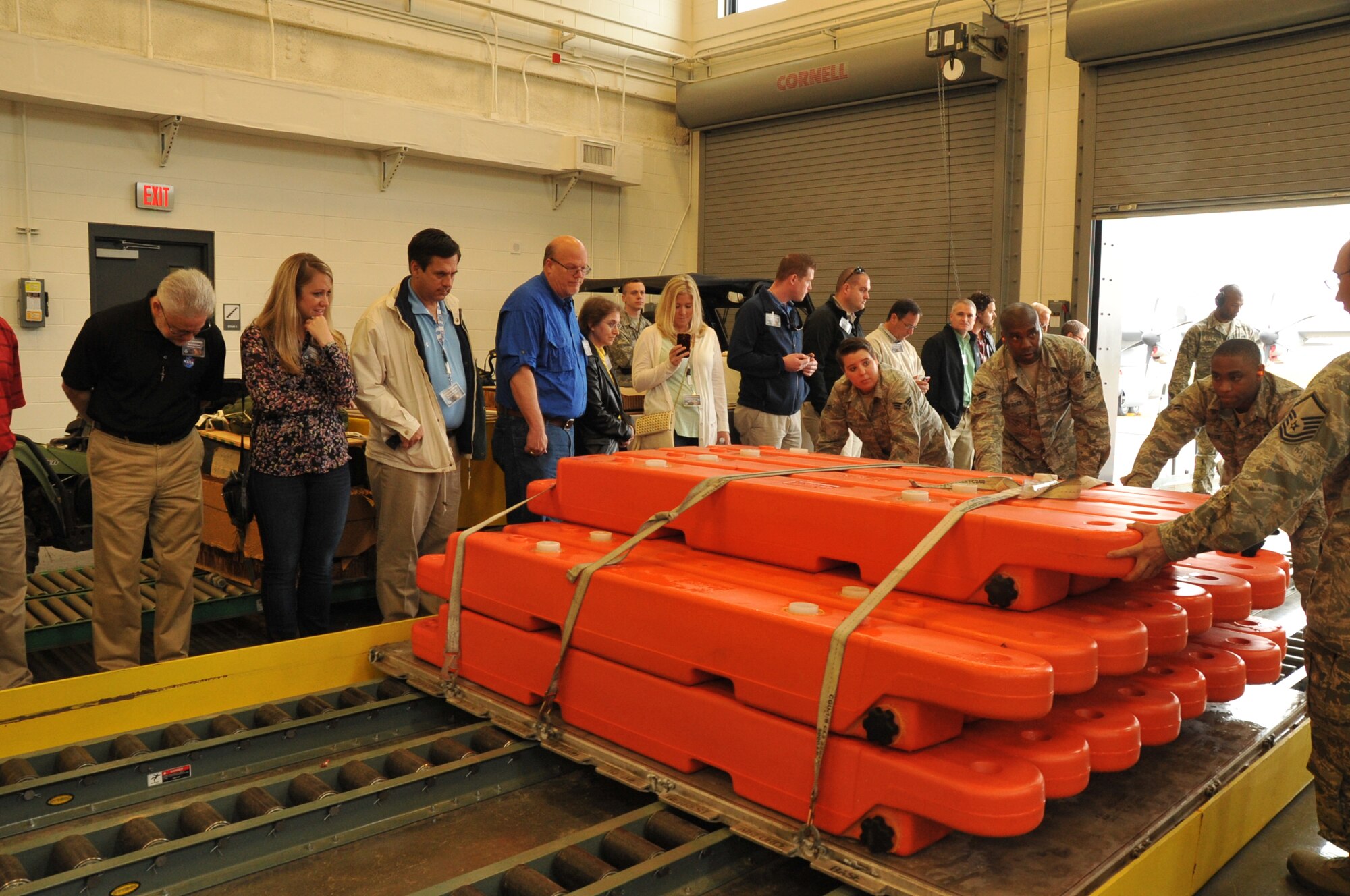 Employers of 403rd Wing reservists are given a mock demonstration of how a C130J is loaded by the 41st Aerial Port Squadron during Employer Appreciation Day April 11, 2015, at Keesler Air Force Base, Mississippi.  Employers were given a tour, demonstrations and participated in a flight on a C130J flown by an 815th Airlift Squadron crew.  (U.S. Air Force photo/Master Sgt. Jessica Kendziorek)