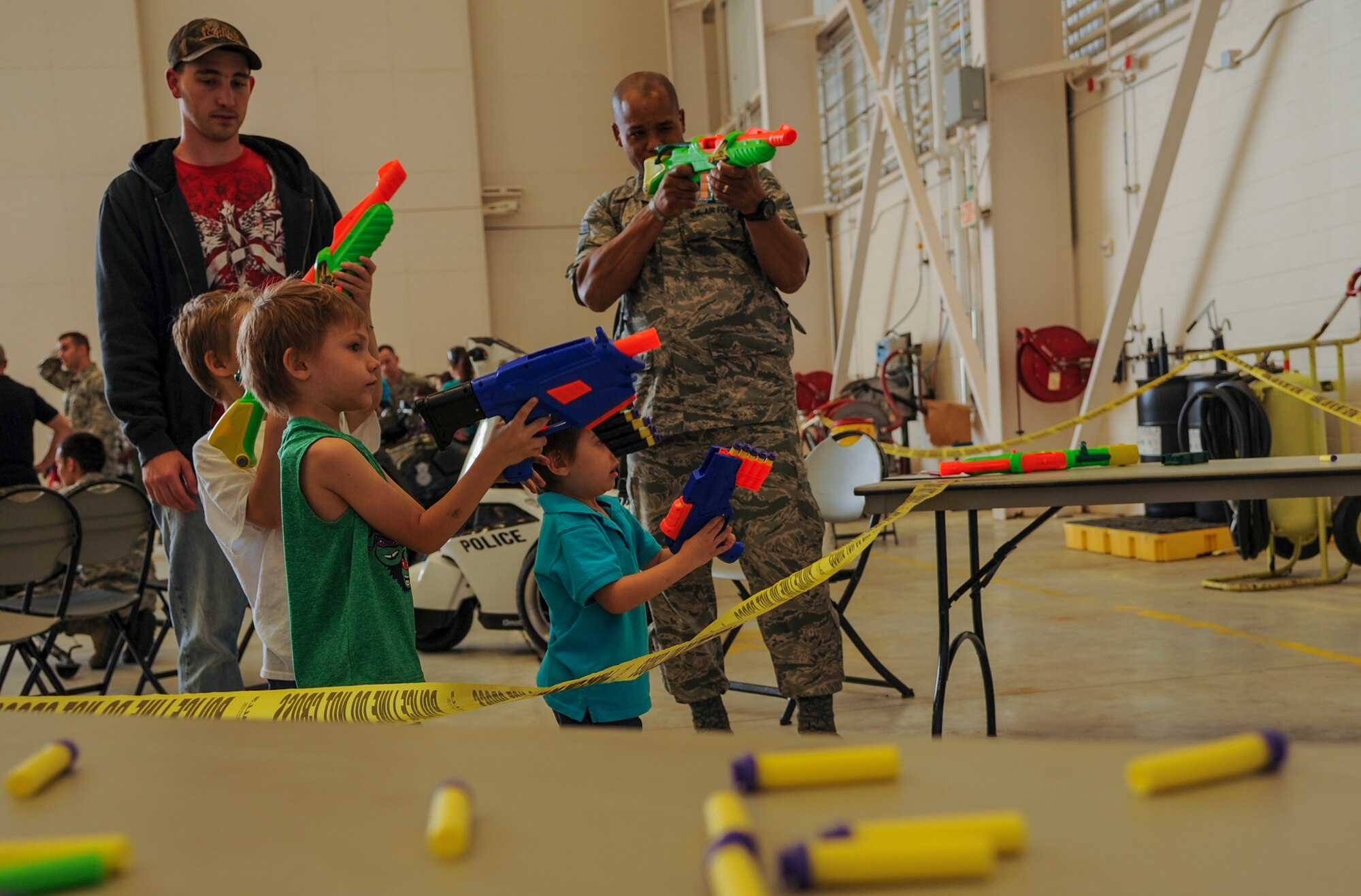 Dominick, Hunter and Blaze learn about weapon safety April 11, 2015, at Little Rock Air Force Base, Ark.  The 19th Security Forces Squadron also had a weapons display, combative demonstration and working dog demonstrations. (U.S. Air Force photo by Airman 1st Class Harry Brexel)
