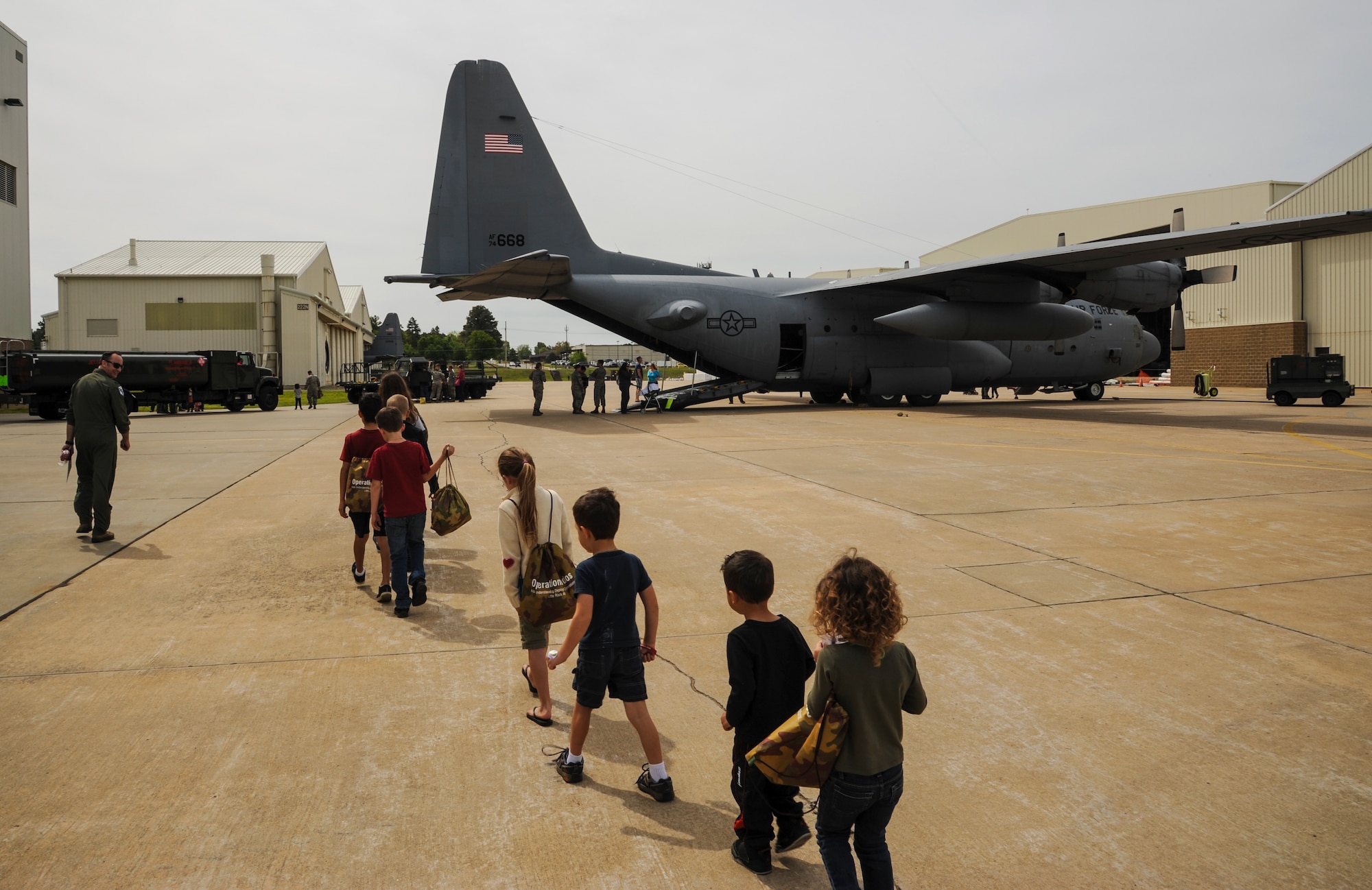 Children march to a C-130H during the Kids Understanding Deployment Operations event April 11, 2015, at Little Rock Air Force Base, Ark. By showing them what their parents do at work and seeing the deployment process, hopefully it will lessen any anxieties they may have about deployments (U.S. Air Force photo by Airman 1st Class Harry Brexel)