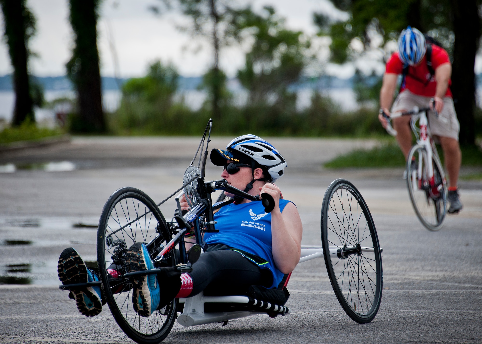Melissa Gonzales, an Air Force Wounded Warrior athlete, uses a hand cycle during the third day of an introductory adaptive sports and rehabilitation camp at Eglin Air Force Base, Fla., April 15. The DOD’s military adaptive sports program enhances warrior recovery by engaging wounded, ill and injured service members in ongoing, daily adaptive activities, based on their interest and ability. (U.S. Air Force photo/Samuel King Jr.)