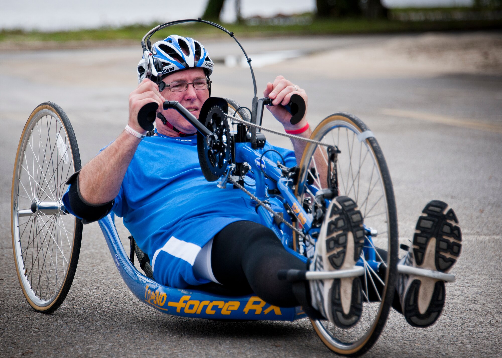 Christopher Rust, an Air Force Wounded Warrior athlete, uses a hand cycle during the third day of an introductory adaptive sports and rehabilitation camp at Eglin Air Force Base, Fla., April 15. The DOD’s military adaptive sports program enhances warrior recovery by engaging wounded, ill and injured service members in ongoing, daily adaptive activities, based on their interest and ability. (U.S. Air Force photo/Samuel King Jr.)