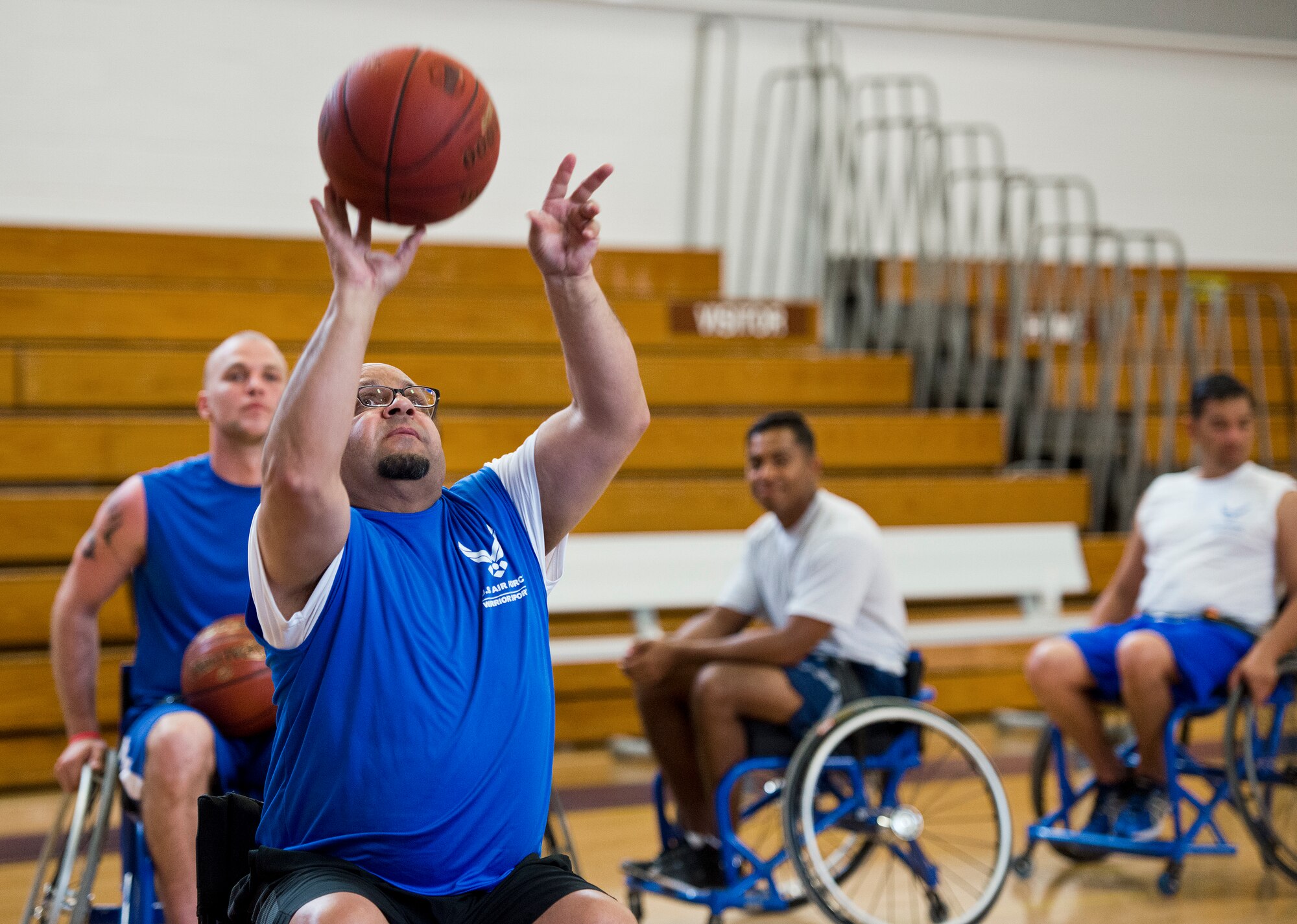 Victor Rivera, an Air Force Wounded Warrior athlete, takes a shot at the basket from a wheelchair during the third day of an introductory adaptive sports and rehabilitation camp at Eglin Air Force Base, Fla., April 15. The DOD’s military adaptive sports program enhances warrior recovery by engaging wounded, ill and injured service members in ongoing, daily adaptive activities, based on their interest and ability. (U.S. Air Force photo/Samuel King Jr.)