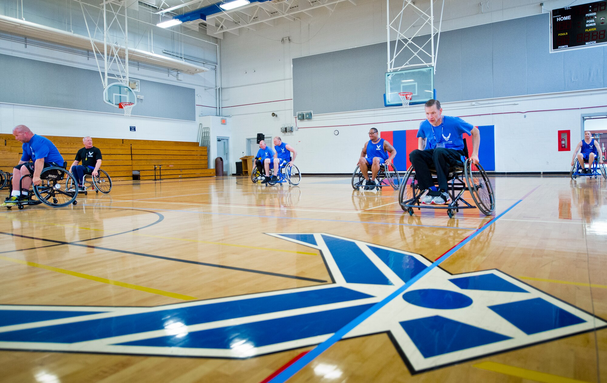 A group of Air Force Wounded Warrior athletes learn to maneuver in wheelchairs during the third day of an introductory adaptive sports and rehabilitation camp at Eglin Air Force Base, Fla., April 15. The DOD’s military adaptive sports program enhances warrior recovery by engaging wounded, ill and injured service members in ongoing, daily adaptive activities, based on their interest and ability. (U.S. Air Force photo/Samuel King Jr.)