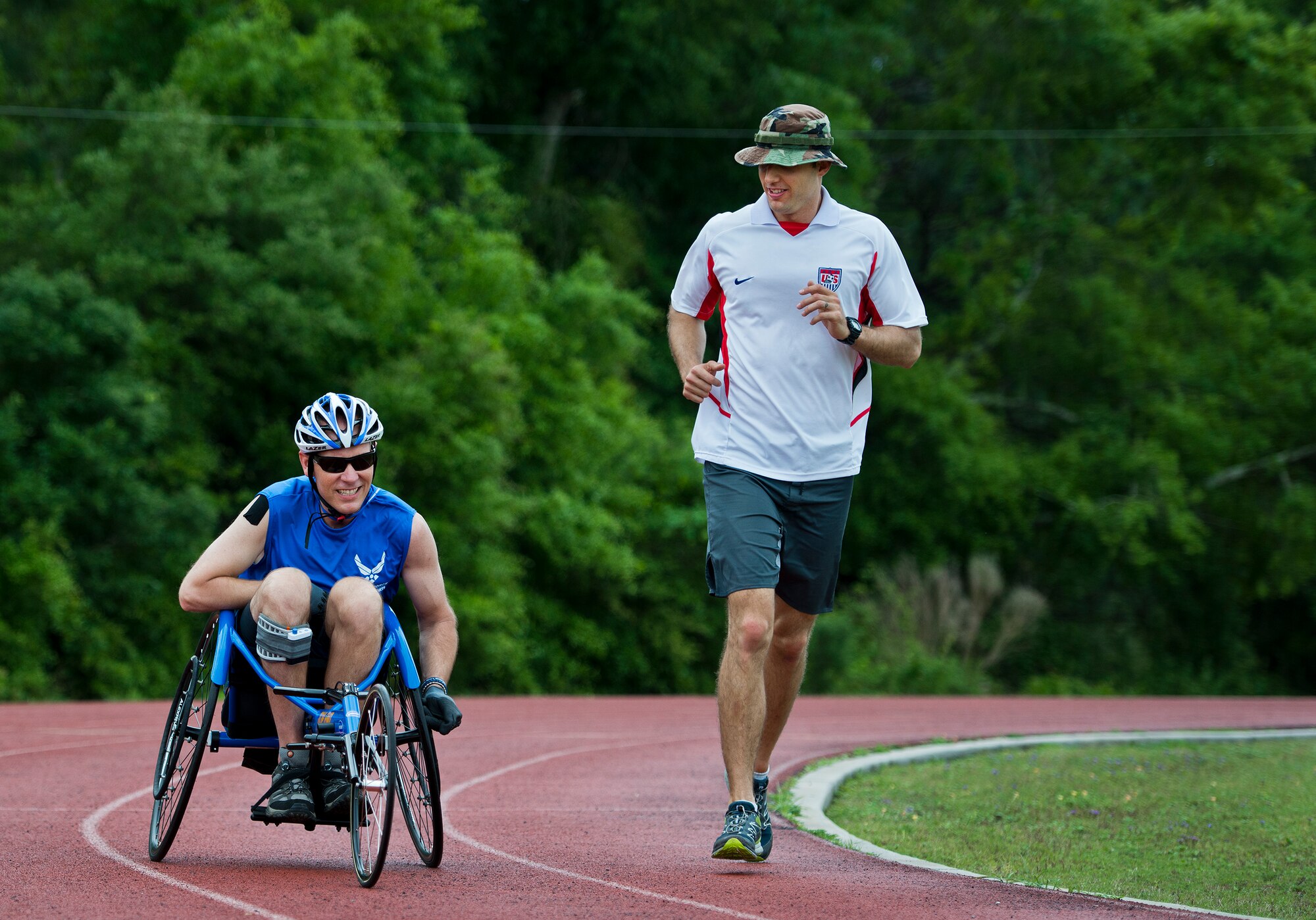 Christopher Cochrane, an Air Force Wounded Warrior athlete, tries out a sportchair with Coach, Rich Harr, during the third day of an introductory adaptive sports and rehabilitation camp at Eglin Air Force Base, Fla., April 15. The DOD’s military adaptive sports program enhances warrior recovery by engaging wounded, ill and injured service members in ongoing, daily adaptive activities, based on their interest and ability. (U.S. Air Force photo/Samuel King Jr.)