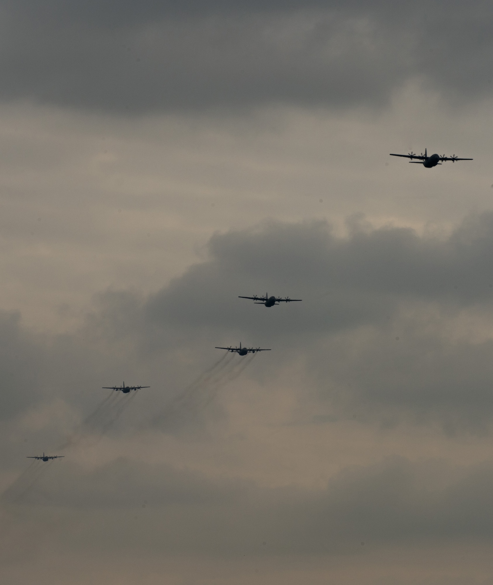 U.S. and Polish C-130s fly in a five-ship formation above Powidz Air Base, Poland, April 15, 2015. Pilots from Ramstein Air Base, Germany and Peterson Air Force Base, Colorado came to Poland as part of an aviation detachment rotation. During the rotation, the Airmen trained alongside their Polish counterparts in formation flying, dropping paratroopers, landing accuracy and much more. (U.S. Air Force photo/Senior Airman Jonathan Stefanko)
