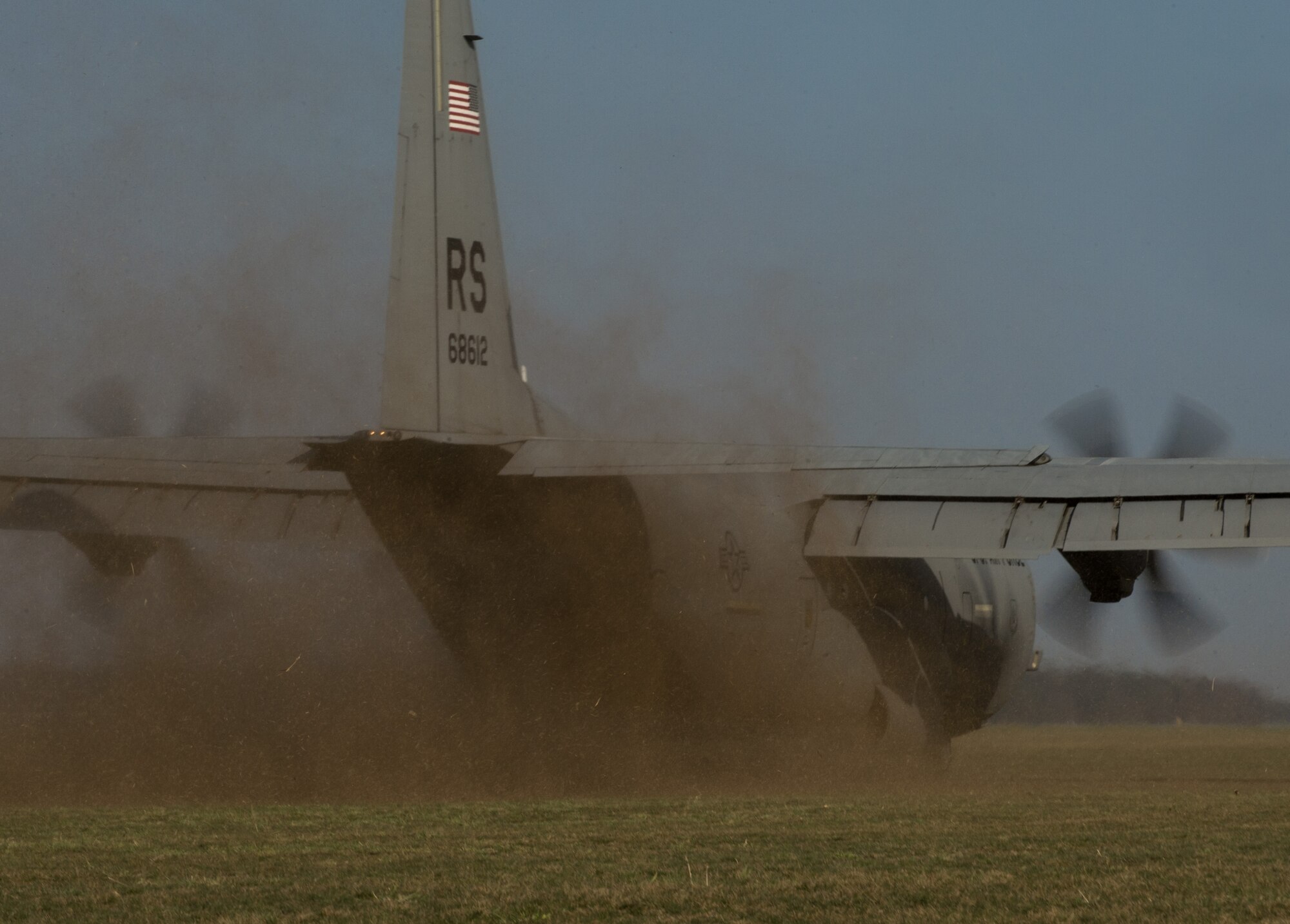 A C-130J Super Hercules assigned to the 37th Airlift Squadron performs a grass-strip landing at Powidz Air Base, Poland, April 10, 2015. U.S. military members traveled to Powidz as part of a flying training deployment where they trained alongside their Polish counterparts. (U.S. Air Force photo/Senior Airman Jonathan Stefanko)