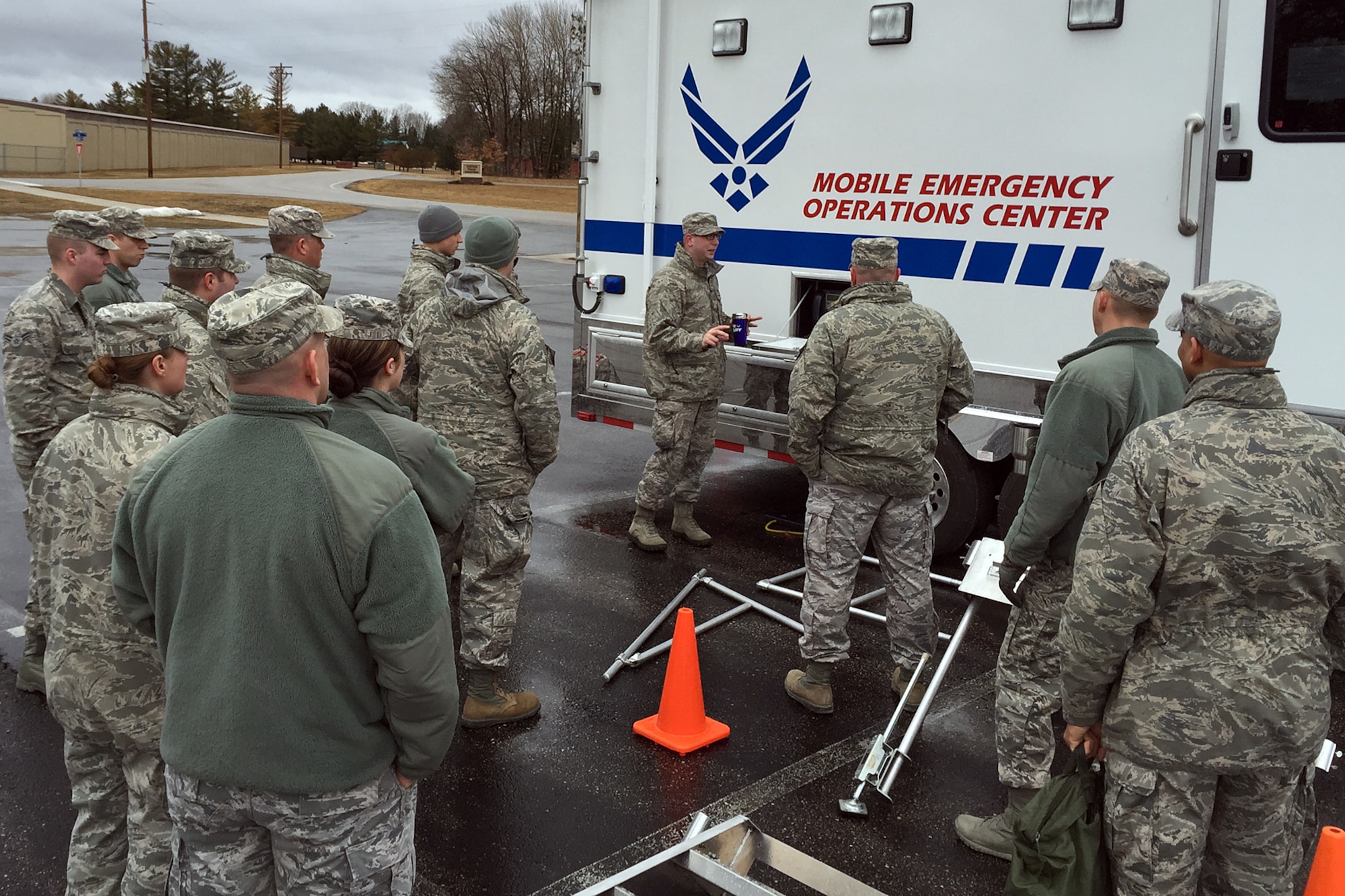 Senior Airman Aric Kaufmann, an emergency management specialist with the 127th Civil Engineer Squadron, briefs a group of Airman on the capabilities of the Mobile Emergency Operations Center during a training session at the Alpena Combat Readiness Training Center, April 10, 2015. The vehicle, based at Selfridge Air National Guard Base, is one of two such MEOCs available to support civil authorities in the Upper Great Lakes region. (U.S. Air National Guard photo)