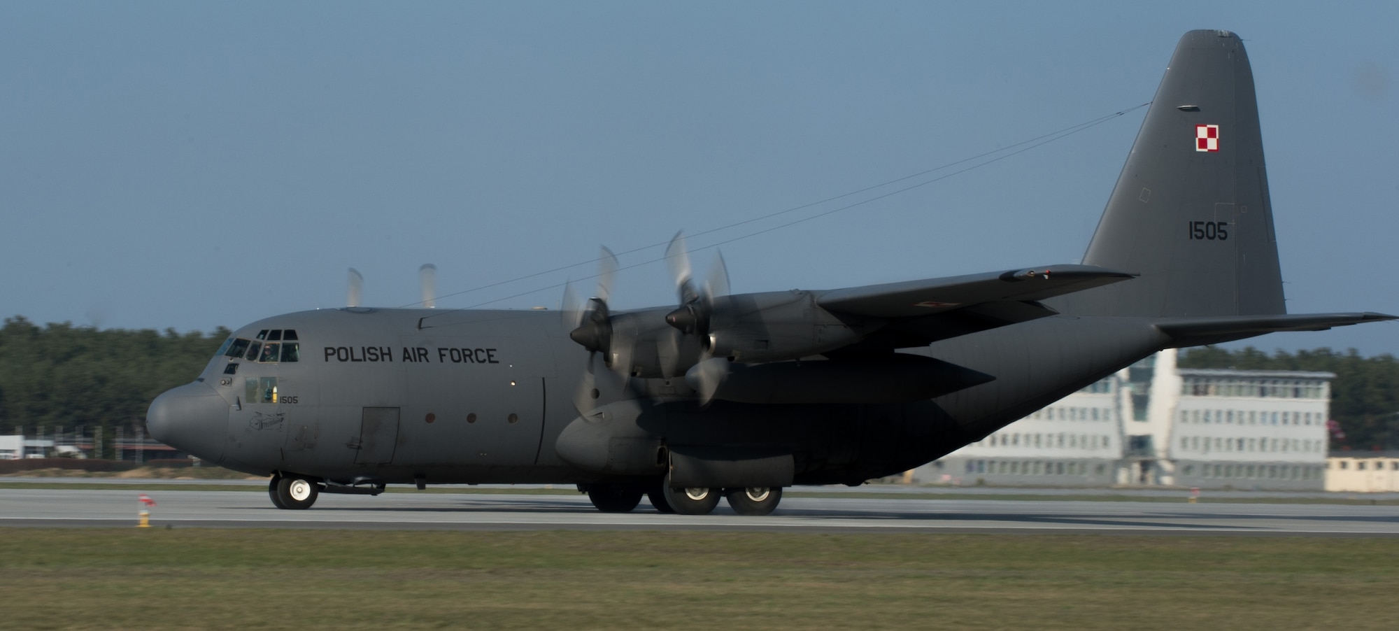 A Polish C-130E legacy model lands at Powiz Air Base, Poland, April 10, 2015. During an aircraft rotation at the U.S. Aviation Detachment in Poland, allied forces worked together to increase interoperability through various including nighttime low level, unimproved landing zone, dropping Polish air force paratroopers and more. (U.S. Air Force photo/Senior Airman Jonathan Stefanko)