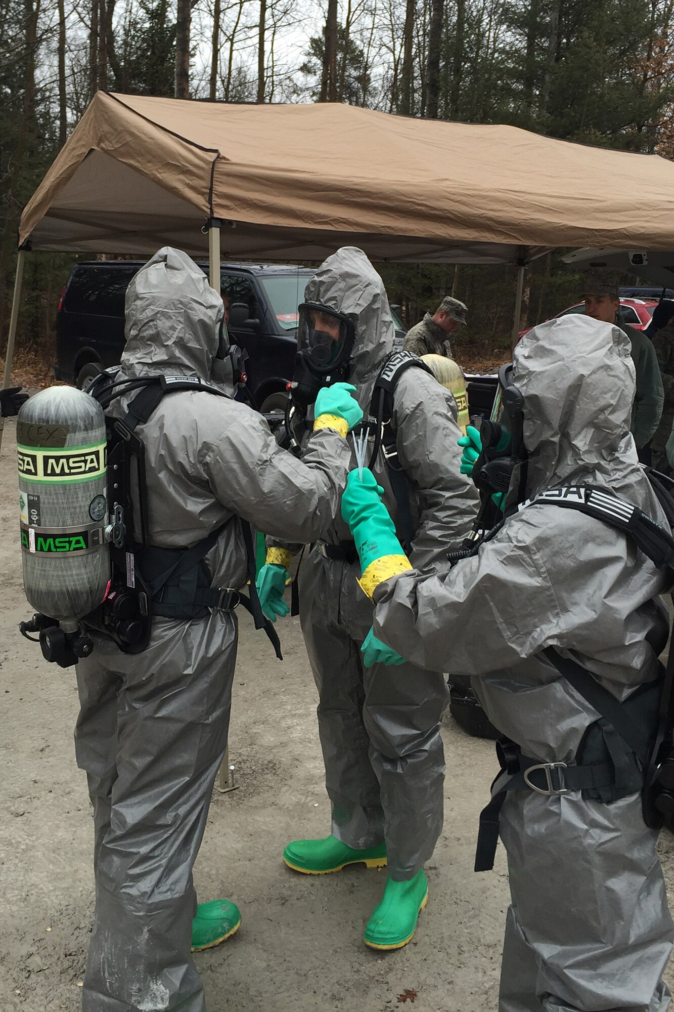 Air National Guard and Air Force Reserve emergency management specialist conduct training on responding to hazardous materials while at the Alpena Combat Readiness Training Center, Mich., April 10, 2015. Emergency management Airmen from six states recently gathered in Alpena to conduct a series of training exercises and classes to maintain their skill proficiency. (U.S. Air National Guard photo)