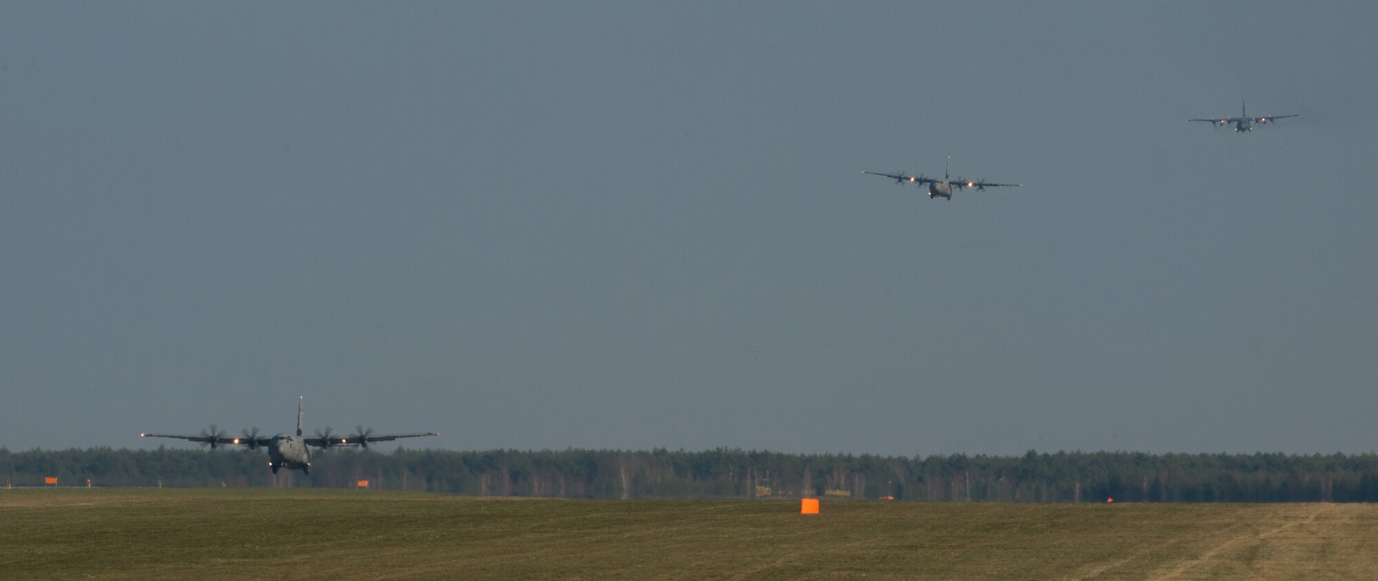 Pilots from the 37th Airlift Squadron fly alongside a Polish pilot during training at Powidz Air Base, Poland, April 10, 2015. Airmen from Ramstein Air Base, Germany arrived to Powidz as part of an aircraft rotation at the U.S. Aviation Detachment. U.S. forces worked alongside their Polish counterparts to build partnership and interoperability for future operations. (U.S. Air Force photo/Senior Airman Jonathan Stefanko)
