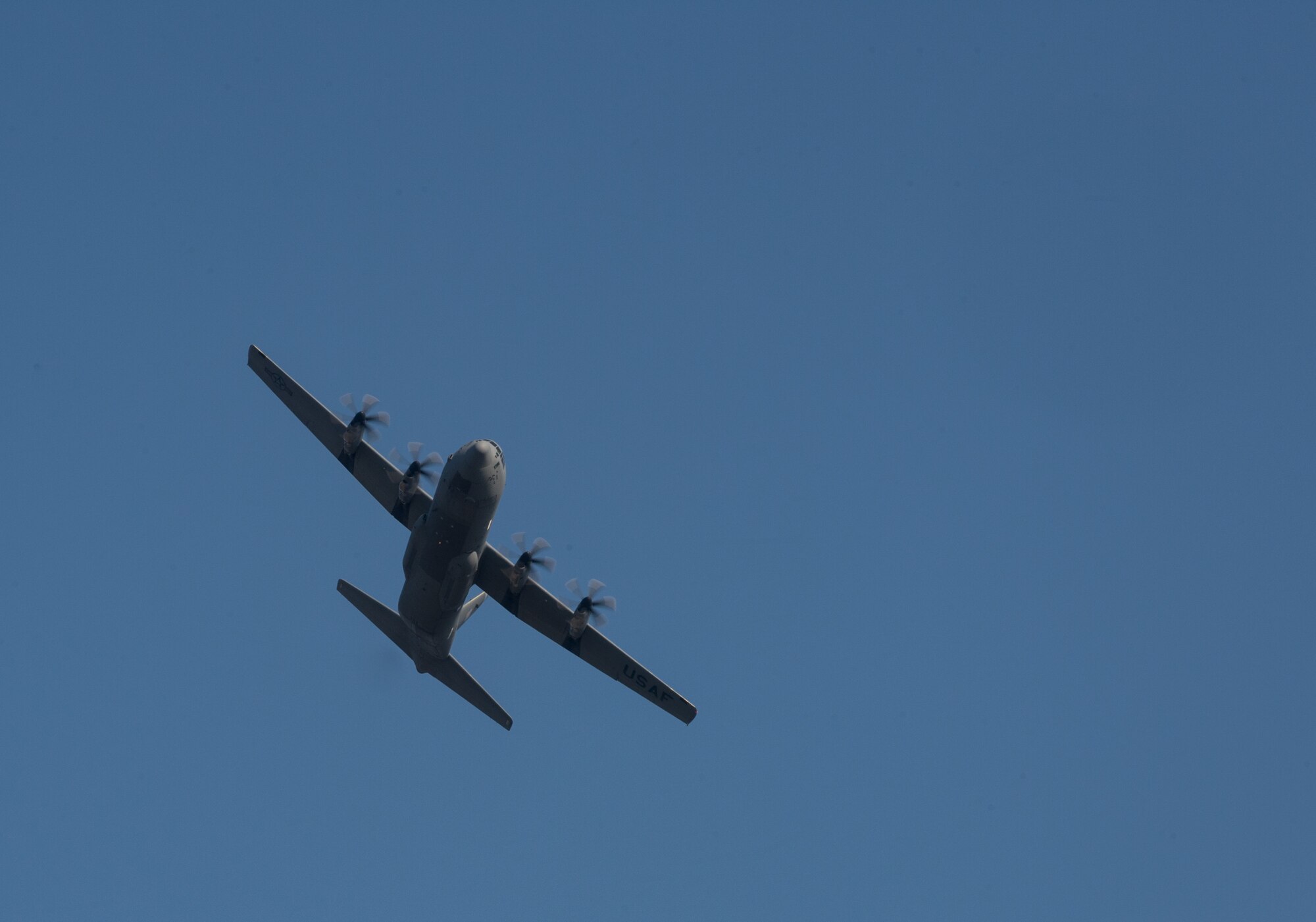 A C-130J Super Hercules assigned to the 37th Airlift Squadron flies above Powidz Air Base, Poland, April 10, 2015. Pilots from the 37th AS trained alongside their Polish counterparts in nighttime low level, unimproved landing zone, dropping Polish air force paratroopers and more. (U.S. Air Force photo/Senior Airman Jonathan Stefanko)