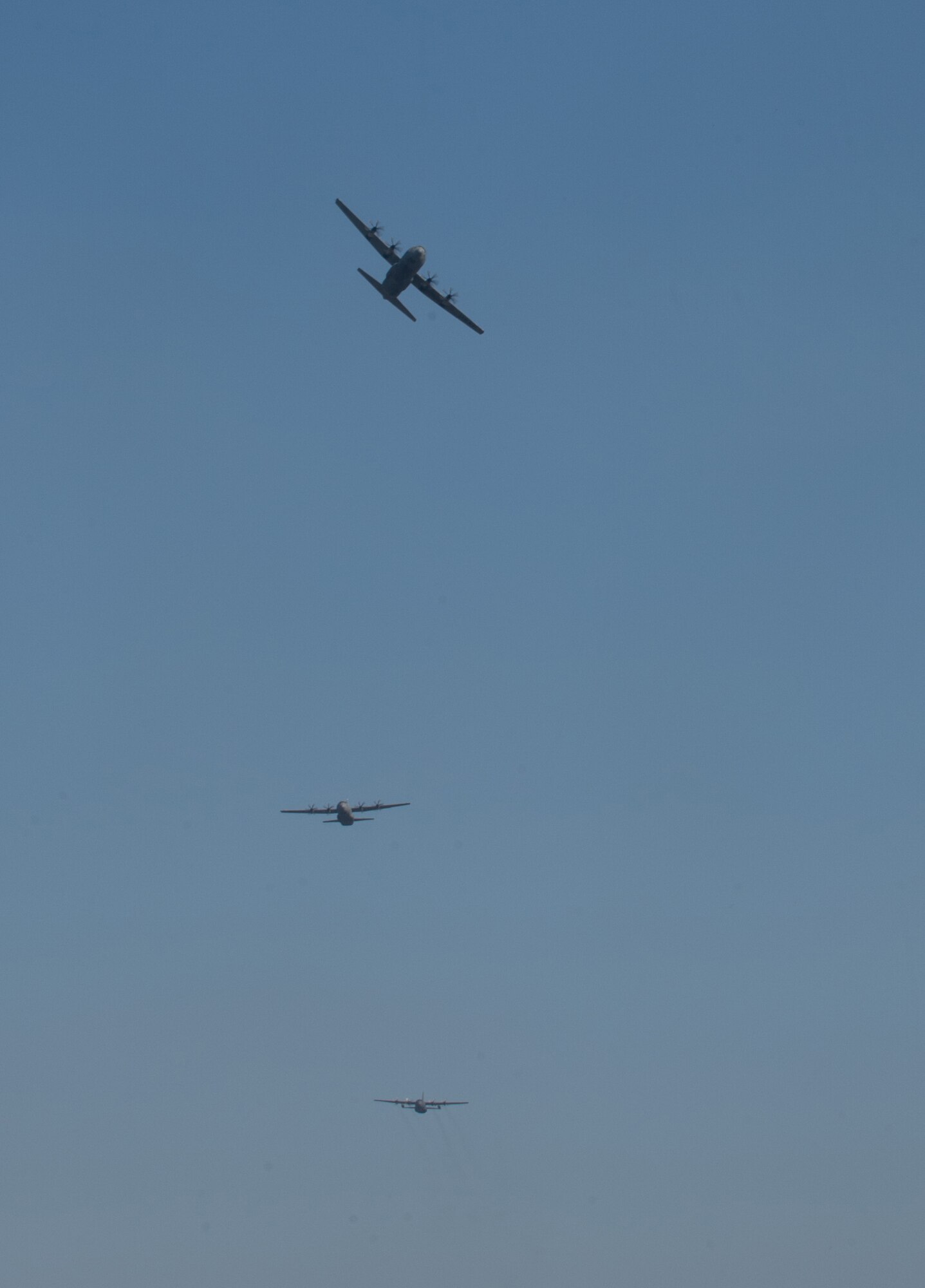 Pilots from the 37th Airlift Squadron fly alongside a Polish pilot during training above Powidz Air Base, Poland, April 10, 2015. Airmen from Ramstein Air Base, Germany arrived to Powidz as part of an aircraft rotation at the U.S. Aviation Detachment. U.S. forces worked alongside their Polish counterparts to build partnership and interoperability for future operations. (U.S. Air Force photo/Senior Airman Jonathan Stefanko)