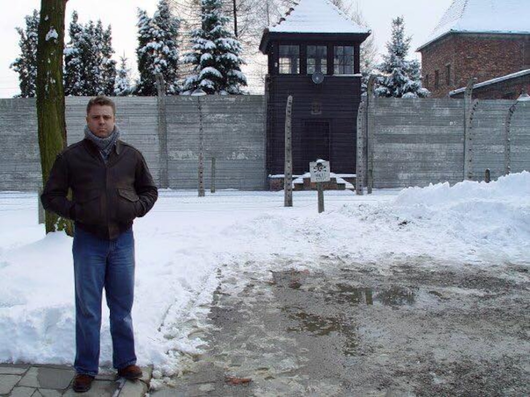 Lt. Col. Glenn Rineheart, 36th Mobility Readiness Squadron commander, stands in front of the site of Nazi Germany's largest and most notorious concentration camp in Aushwitz, Poland, in 2004. (Courtesy photo/Released) 