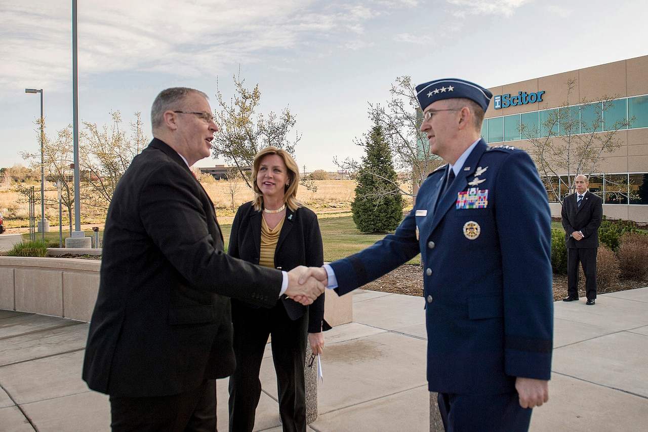 Air Force Gen. John E. Hyten, commander of Air Force Space Command, right, and Secretary of the Air Force Deborah Lee James, center, greet Deputy Defense Secretary Bob Work as he arrives at the Scitor Complex to attend and speak at the Space Symposium in Colorado Springs, Colo., April 15, 2015.
DoD photo by U.S. Air Force Master Sgt. Adrian Cadiz