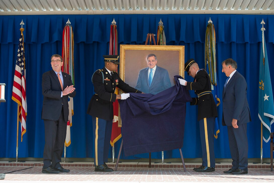 Defense Secretary Ash Carter, left, and former Defense Secretary Leon ...