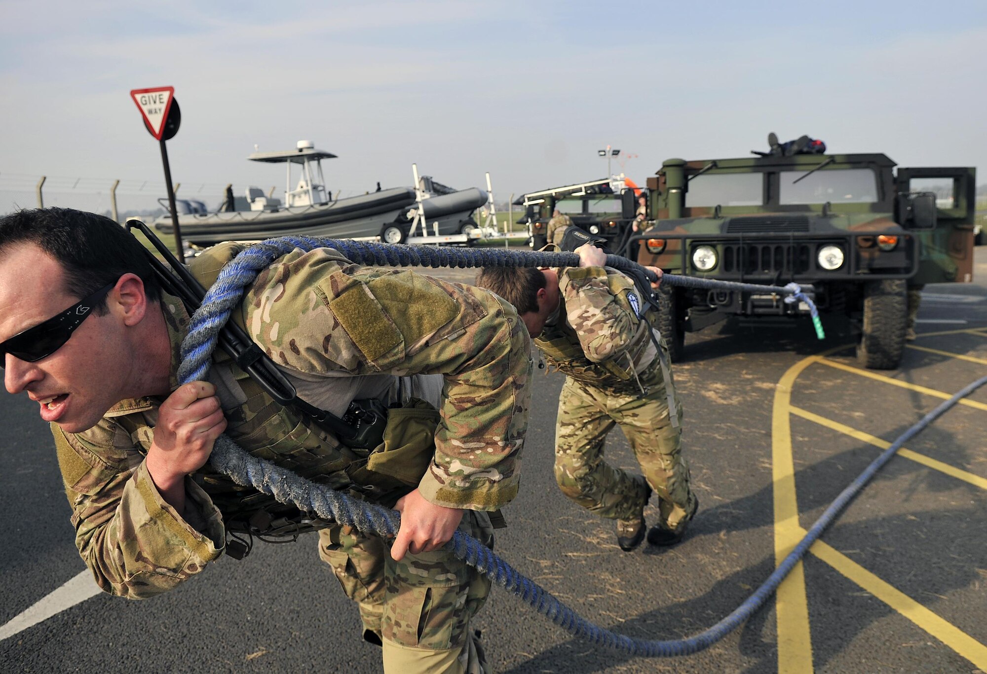 Air Commandos from the 321st Special Tactics Squadron pull a Humvee during the Monster Mash April 10, 2015, on RAF Mildenhall, England. A Monster Mash is a long-standing special tactics tradition which combines event designed to test strength, stamina and teamwork skills. (U.S. Air Force photo by Airman 1st Class Kyla Gifford)
