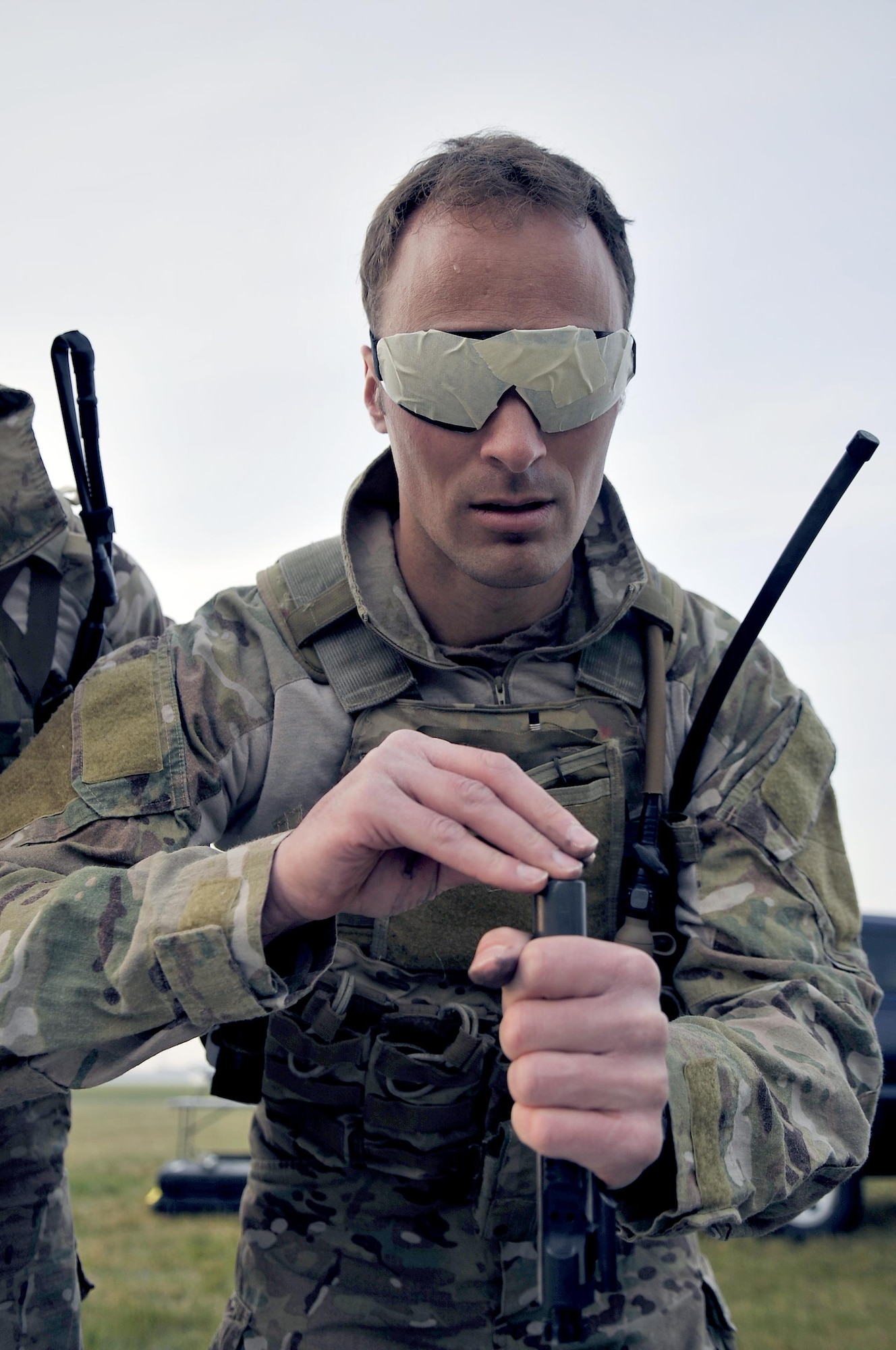 An Air Commando from the 321st Special Tactics Squadron participates in a blind weapons assembly challenge during the Monster Mash April 10, 2015 on RAF Mildenhall, England. A Monster Mash is a long-standing special tactics tradition which combines event designed to test strength, stamina and teamwork skills. (U.S. Air Force photo by Airman 1st Class Kyla Gifford)