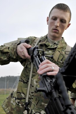 An Air Commando from the 321st Special Tactics Squadron participates in a weapons assembly challenge during the Monster Mash April 10, 2015 on RAF Mildenhall, England. A Monster Mash is a long-standing special tactics tradition which combines event designed to test strength, stamina and teamwork skills. (U.S. Air Force photo by Airman 1st Class Kyla Gifford)