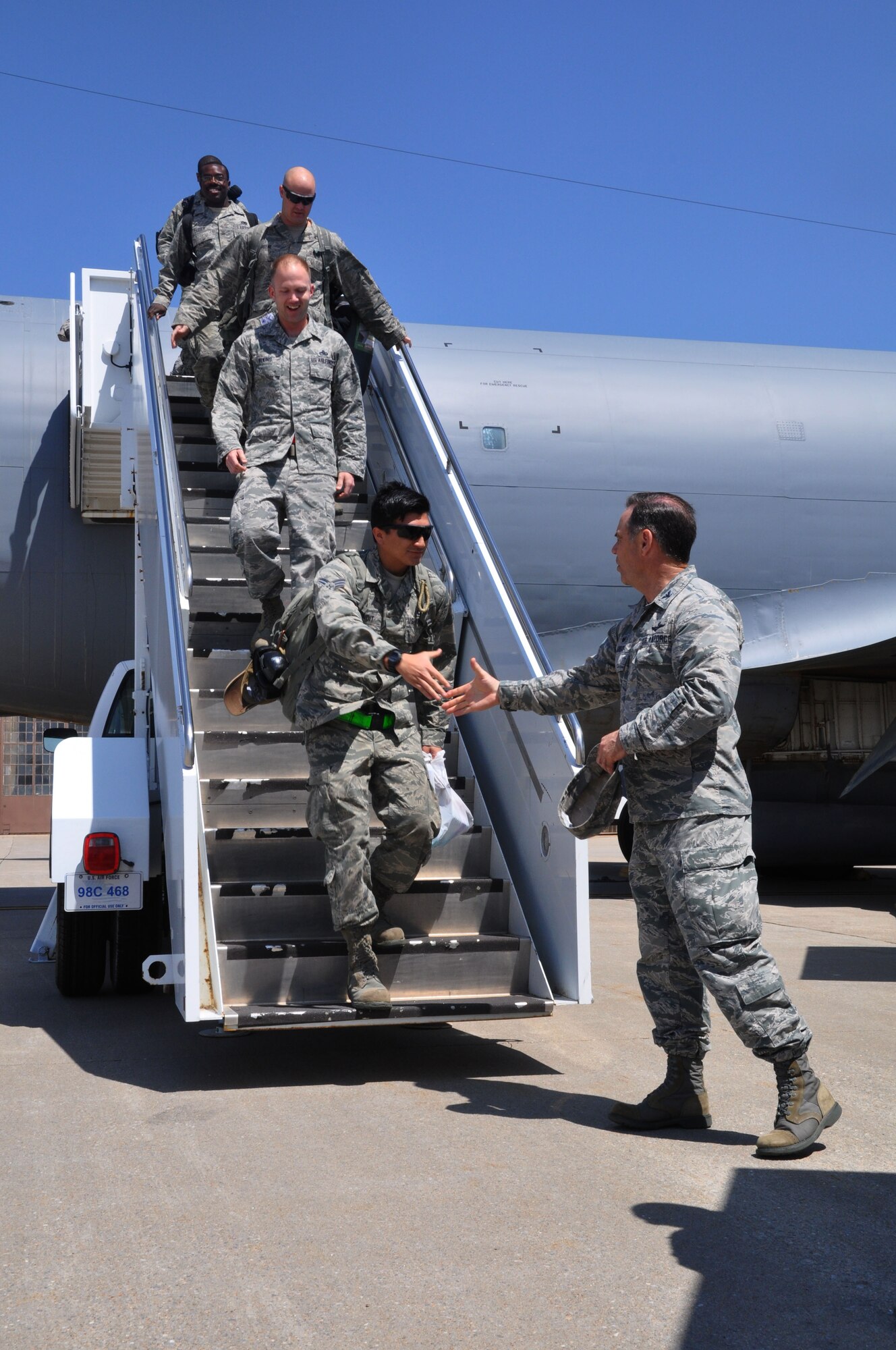 Col. Mark S. Larson, 931st Air Refueling Group commander, greets members of the 931 ARG, as they return from a deployment April 16, 2015, at McConnell Air Force Base. More than 15 members of the 931st Air Refueling Group returned from a deployment to Southwest Asia. (U.S. Air Force photo by Tech. Sgt. Abigail Klein)