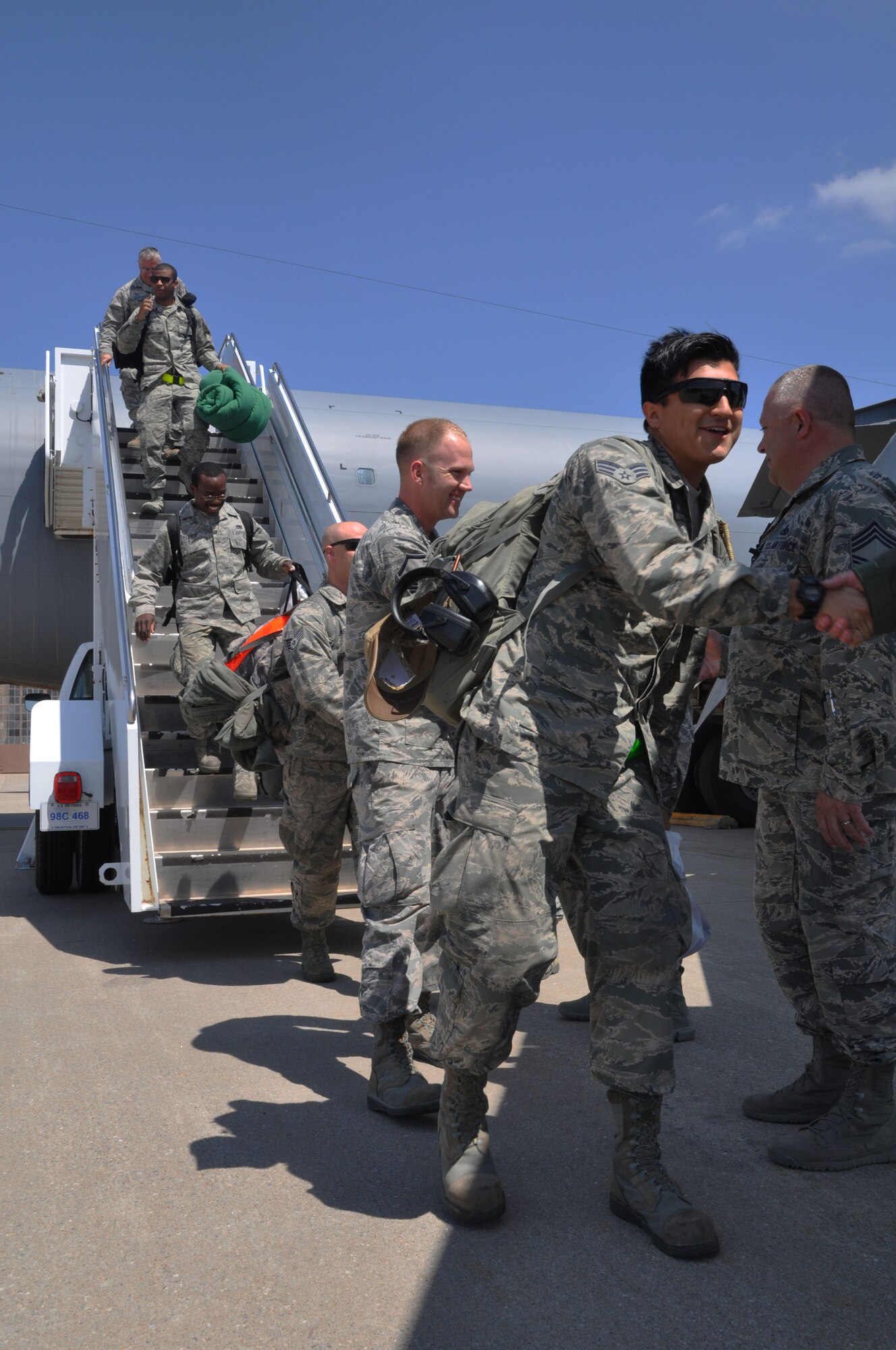 More than 15 members of the 931st Air Refueling Group are greeted by leadership as they step of a KC-135 Stratotanker April 16, 2015, at McConnell Air Force Base, Kan. The Airmen had just returned from a deployment to Southwest Asia, where they provided support to the 379th Air Expeditionary Wing. (U.S. Air Force photo by Tech. Sgt. Abigail Klein)