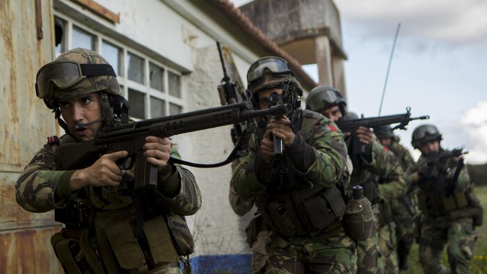 Portuguese Marines, Fuzileiros, move to clear a room during an assault training exercise near Lisbon, Portugal, April 9, 2015. U.S. Marines with Special-Purpose Marine Air-Ground Task Force Crisis Response-Africa and Fuzileiros simulated breaching a compound side-by-side demonstrating the interoperability of the two NATO forces for potential future operations. (U.S. Marine Corps photograph by Lance Cpl. Christopher Mendoza/Released)